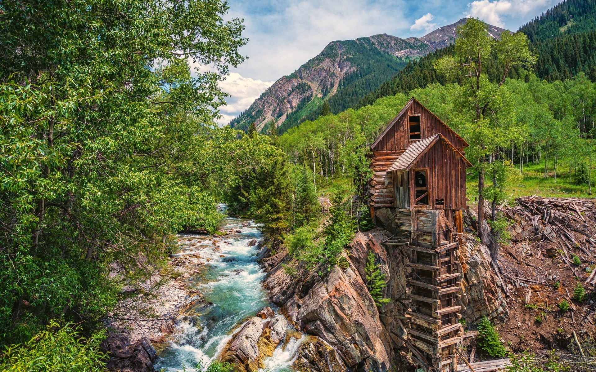 Old wooden mill by a mountain stream HD Wallpaper