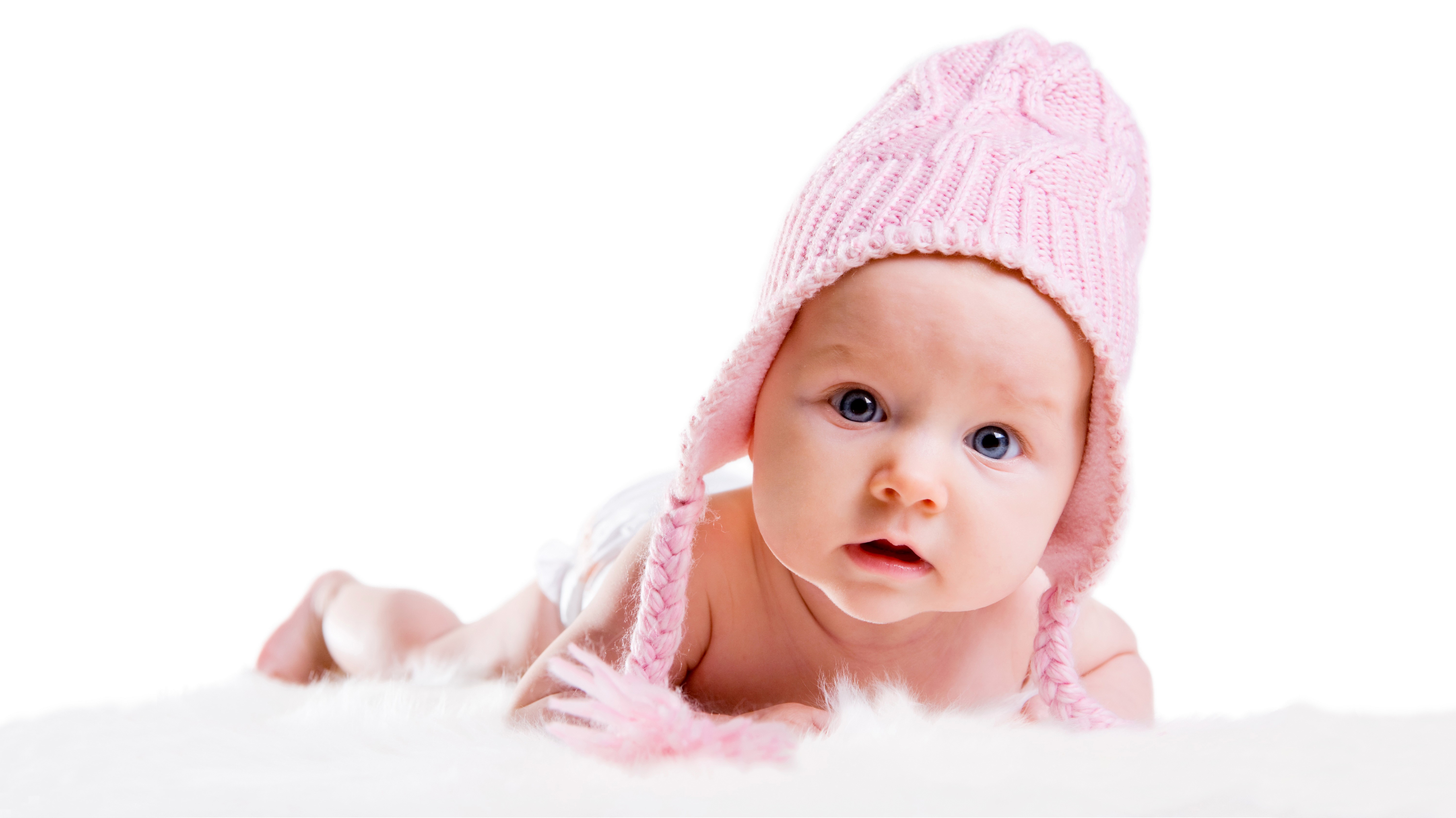 Baby wearing a pink winter hat HD Wallpaper