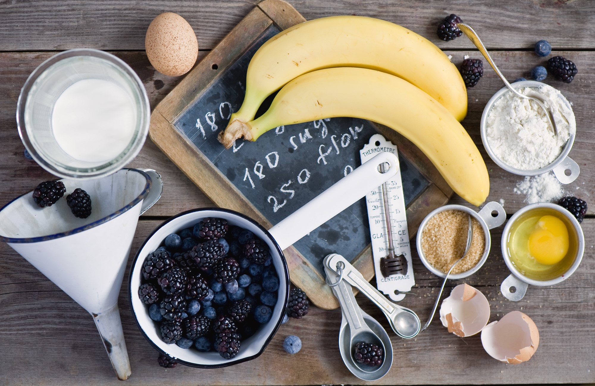 Baking ingredients: bananas, berries, eggs, flour, sugar, milk HD Wallpaper