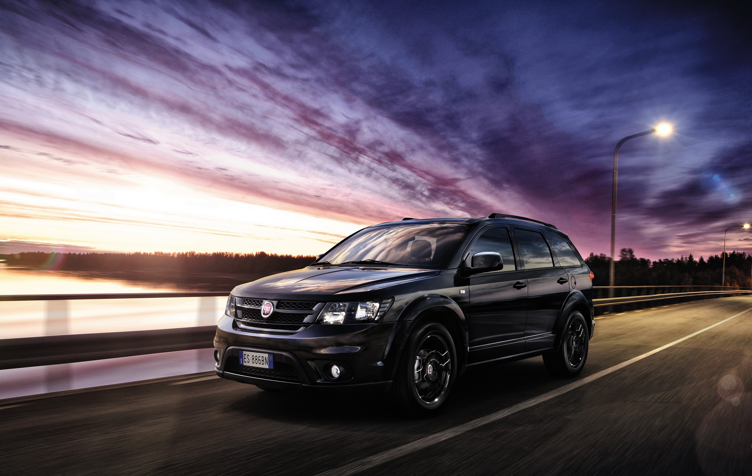 2014 Fiat Freemont Black Code AWD on a road at dusk HD Wallpaper