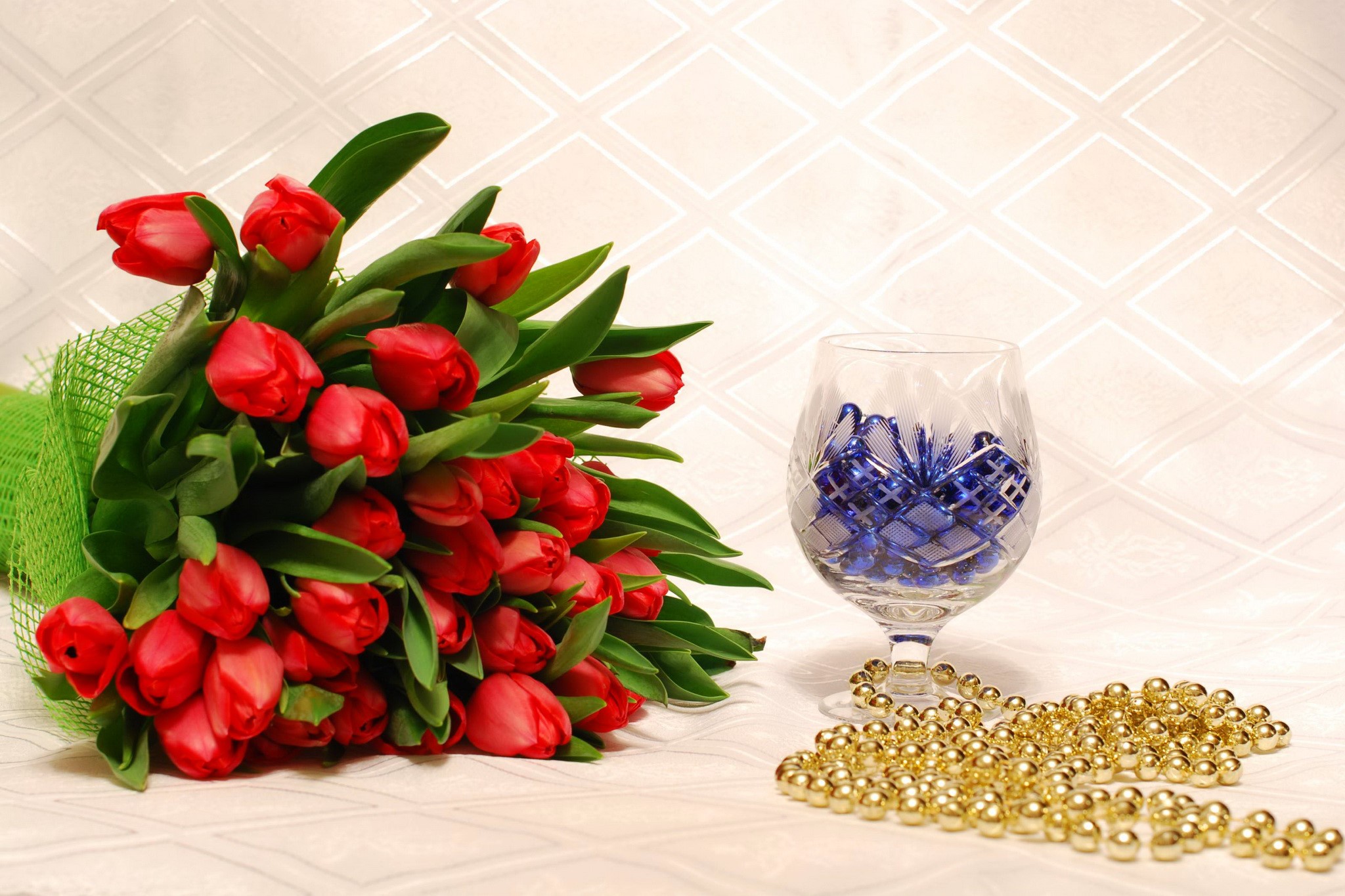 Red Tulips in a Bouquet with a Crystal Glass and Gold Beads HD Wallpaper