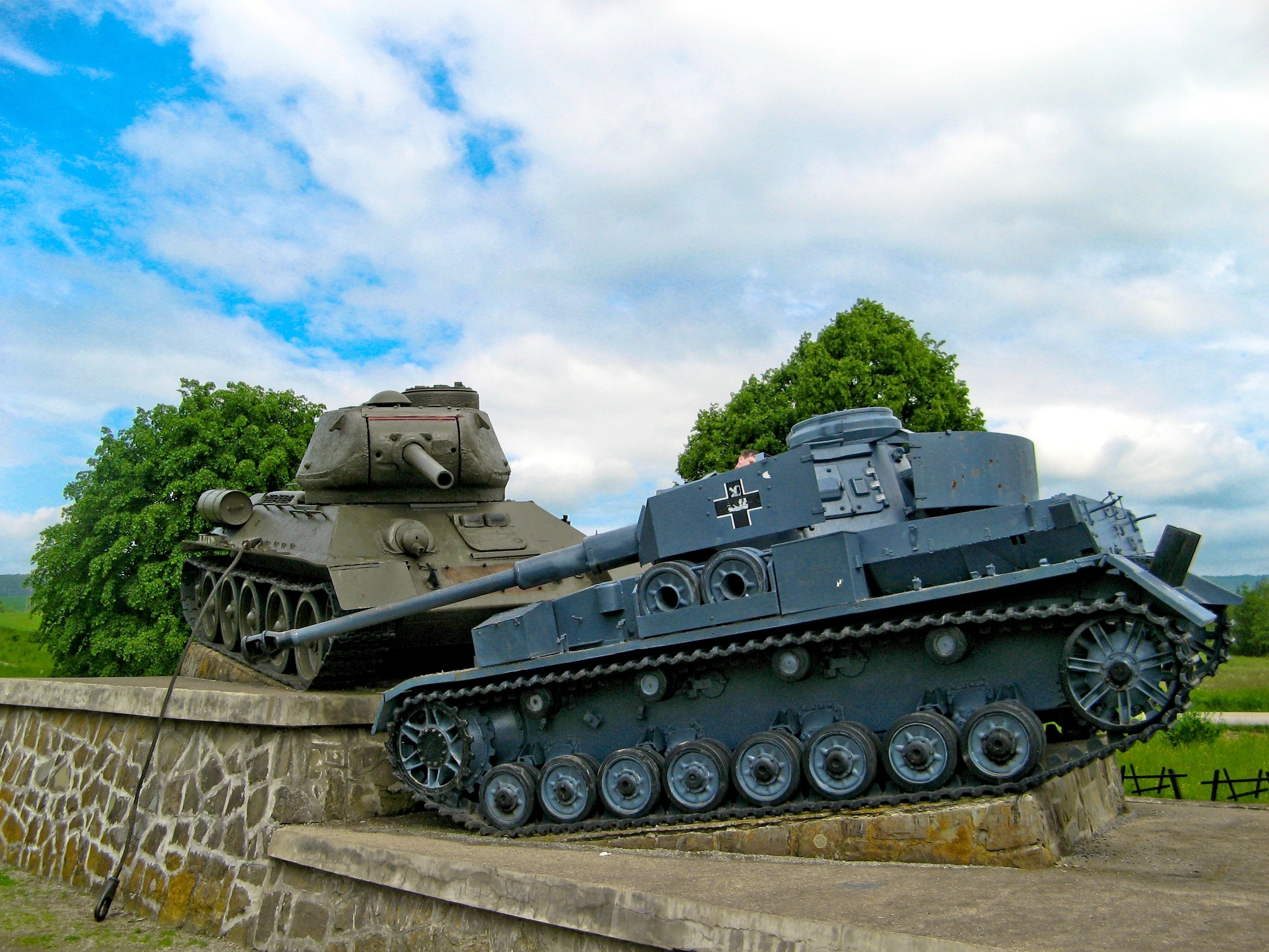 Two tanks on display, one Soviet and one German HD Wallpaper