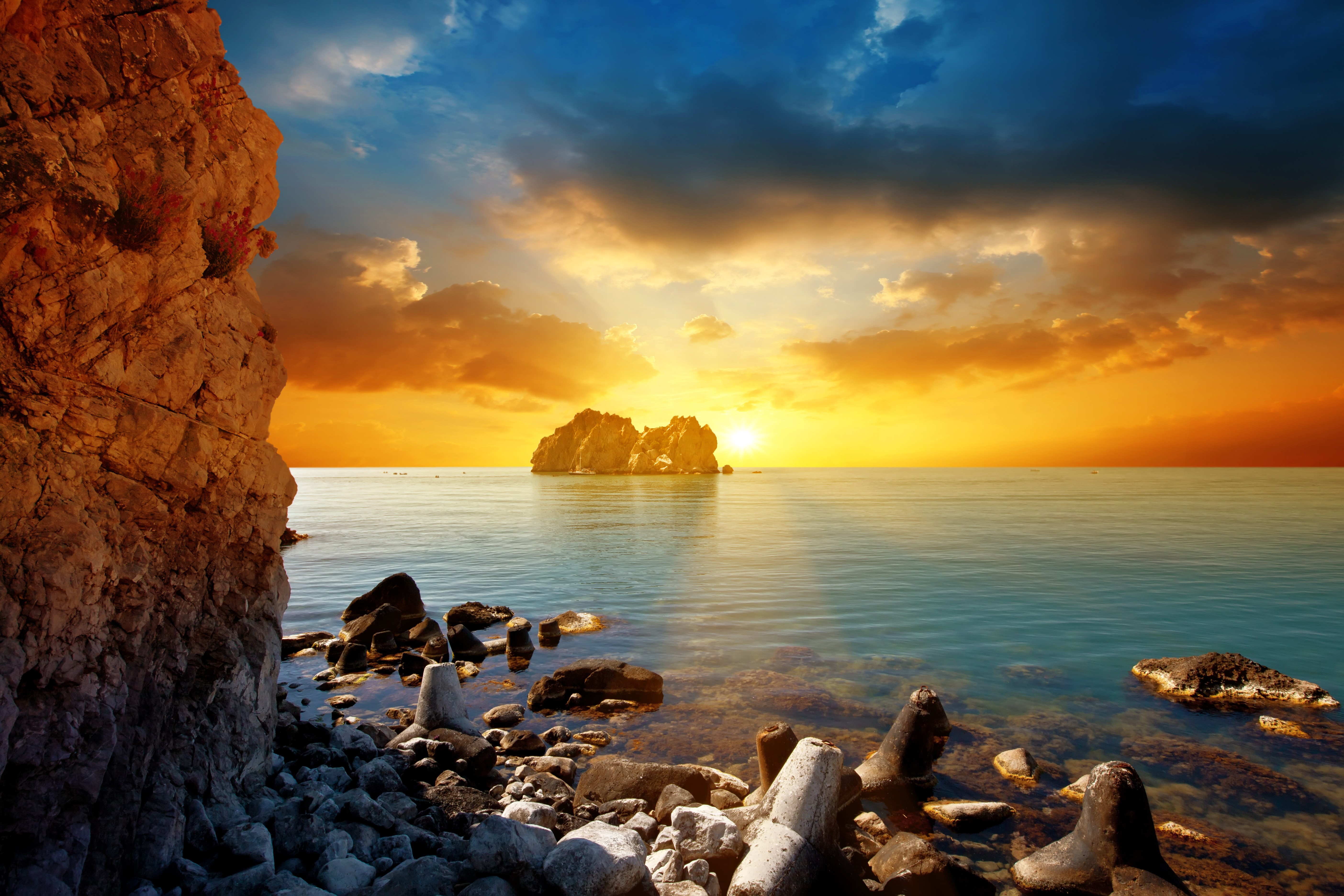Sunset over the sea with rocky coast HD Wallpaper