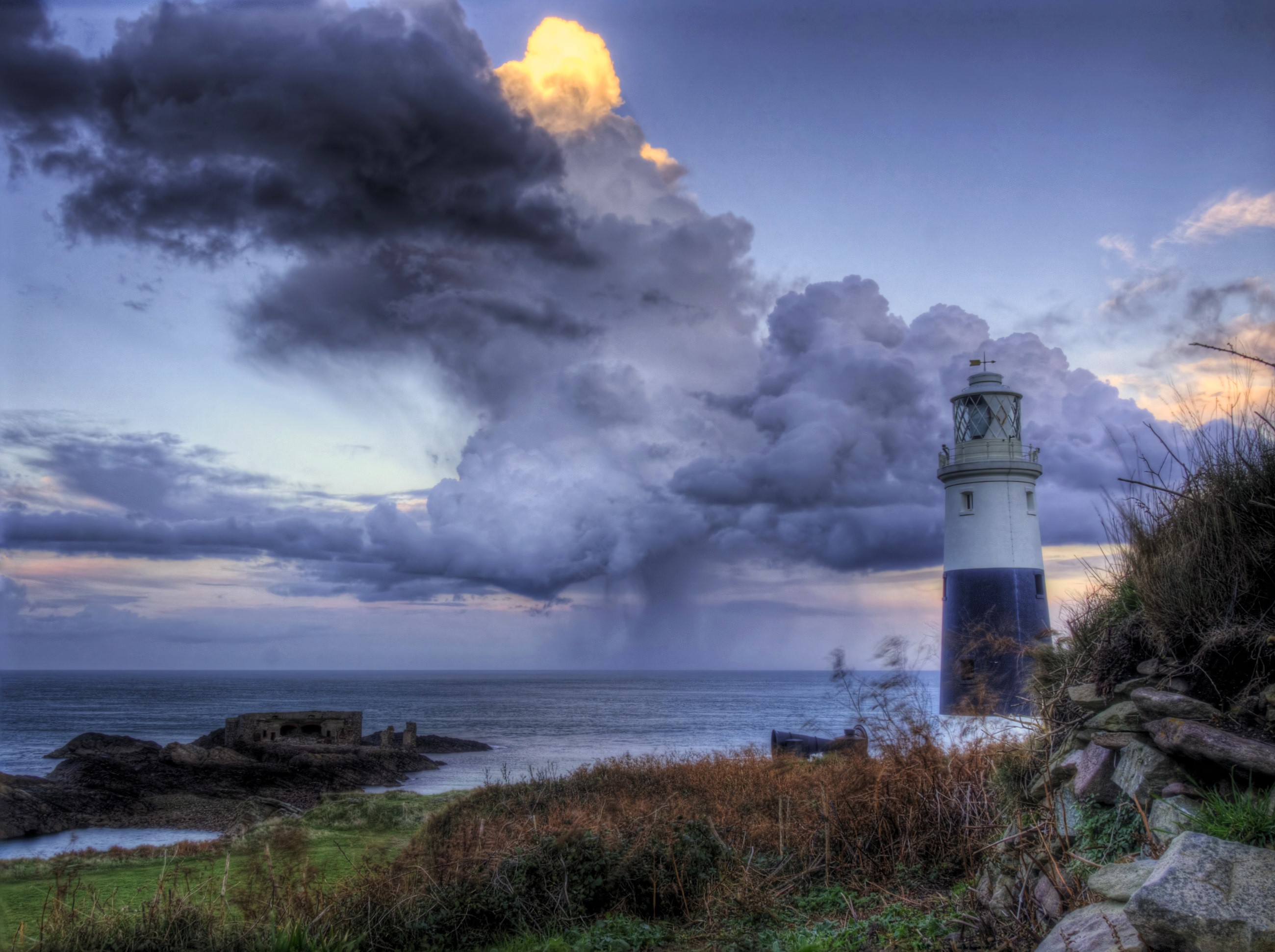 Lighthouse on the coast of Alderney, United Kingdom HD Wallpaper