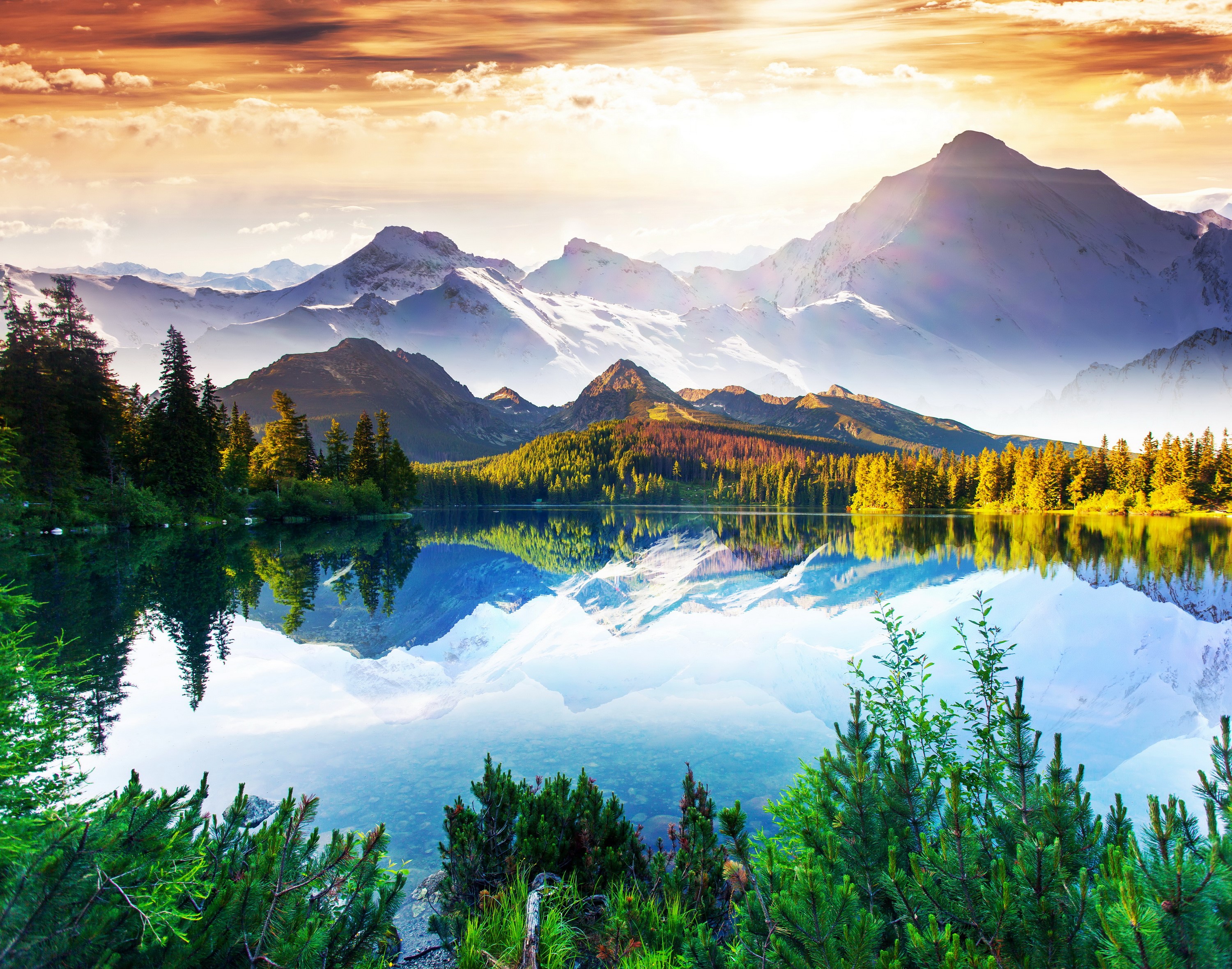 Lake and snow-capped mountains at sunset HD Wallpaper