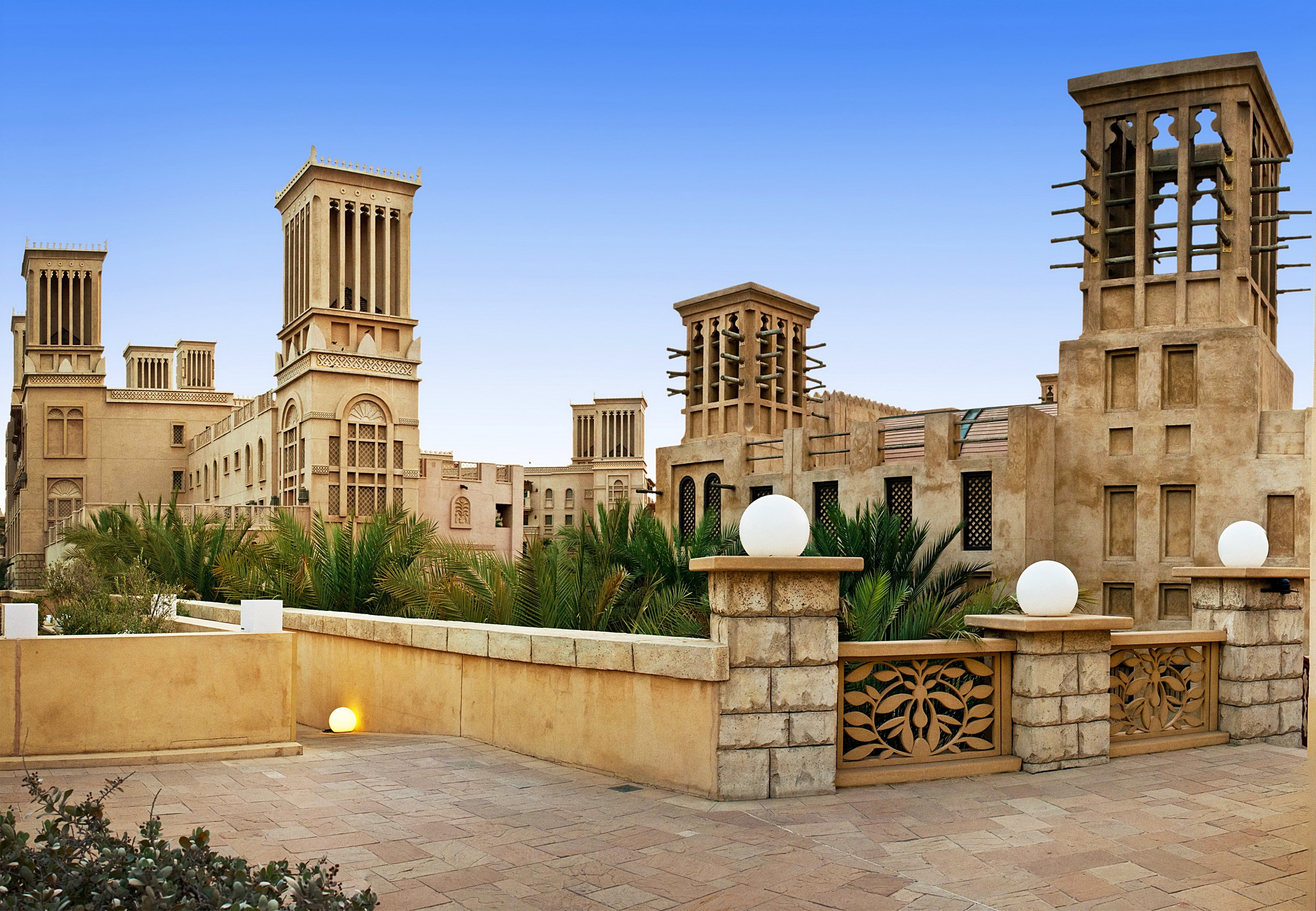 Traditional Arabic architecture with wind towers in Dubai HD Wallpaper
