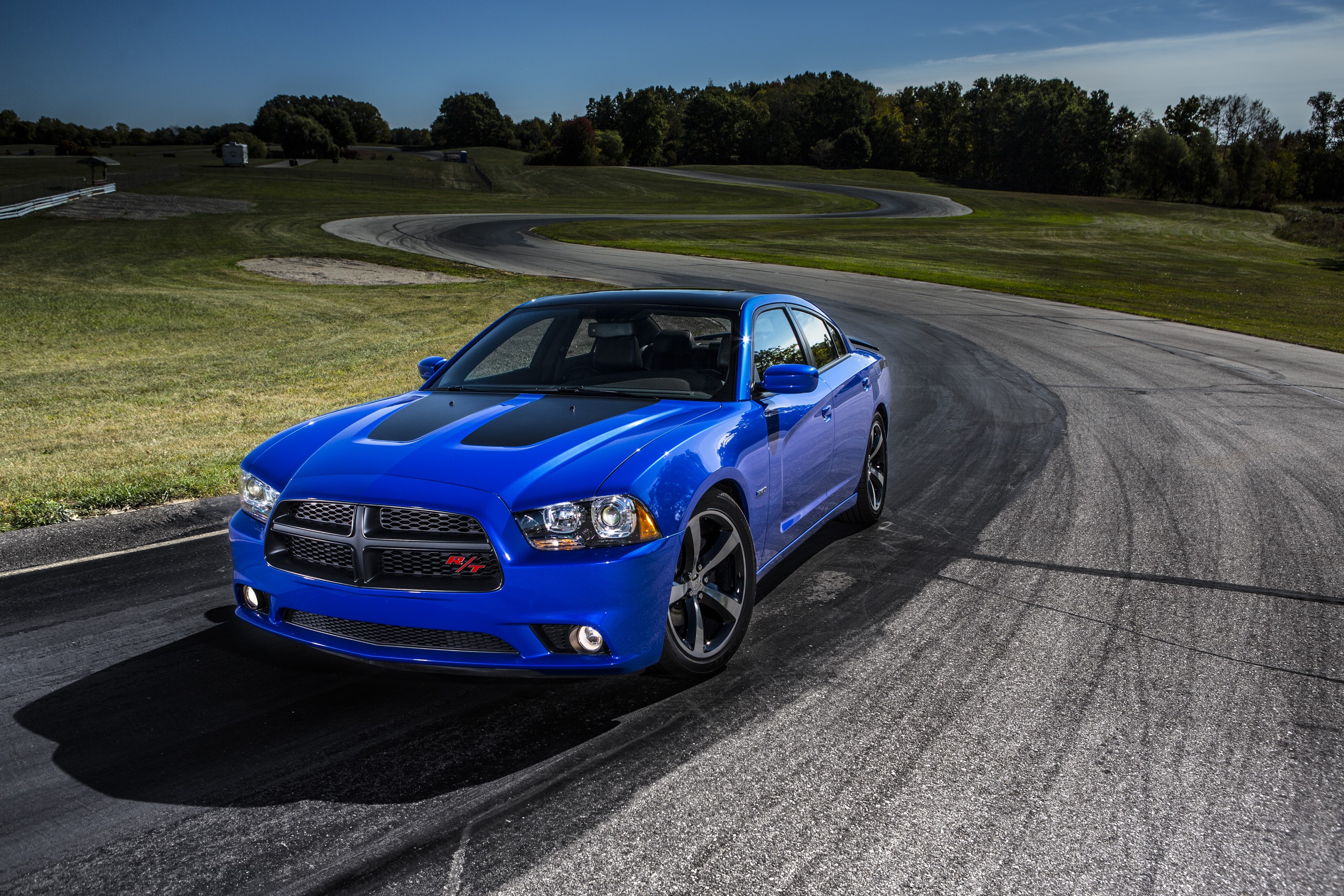 Blue 2013 Dodge Charger Daytona on a race track HD Wallpaper