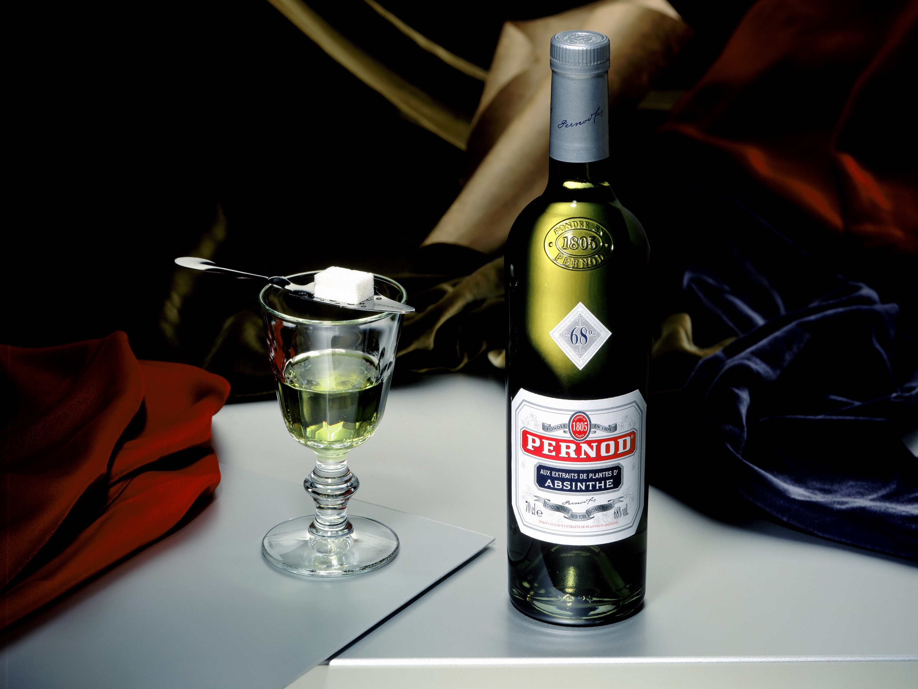 Pernod Absinthe bottle and glass with sugar cube HD Wallpaper