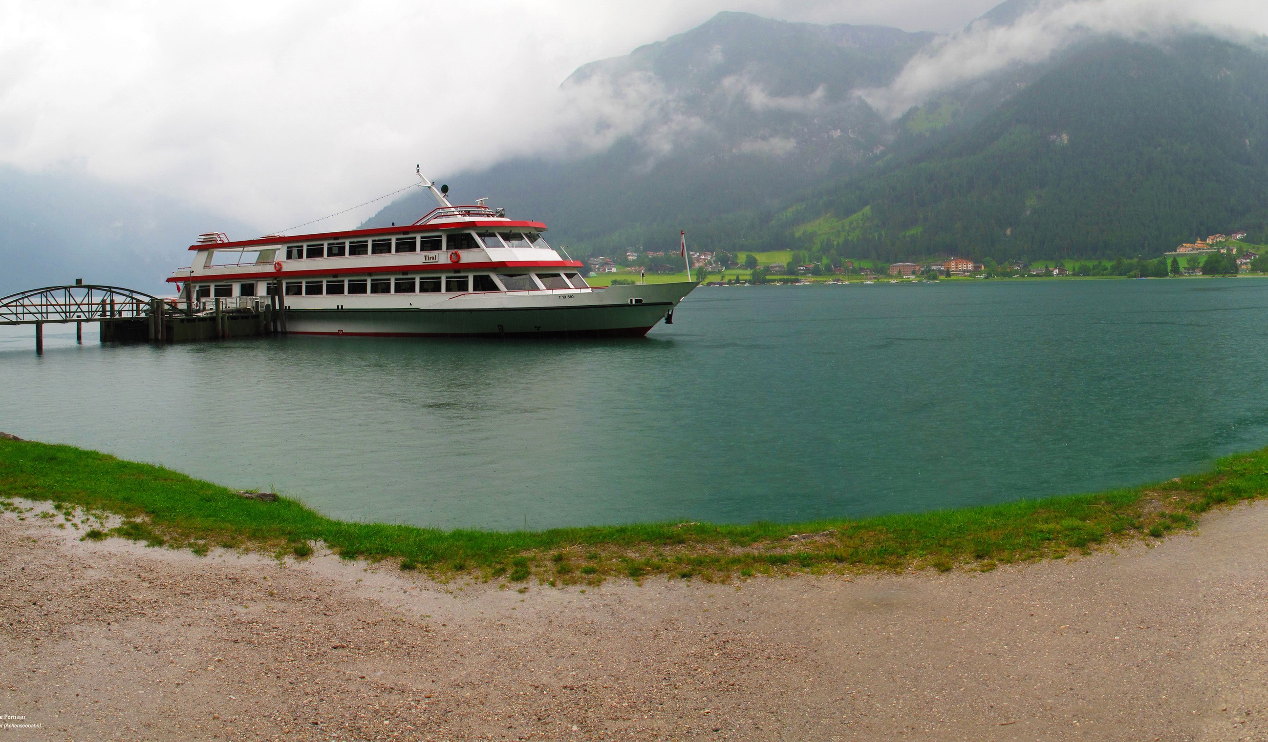 Passenger ship docked at a pier on a lake in Austria HD Wallpaper