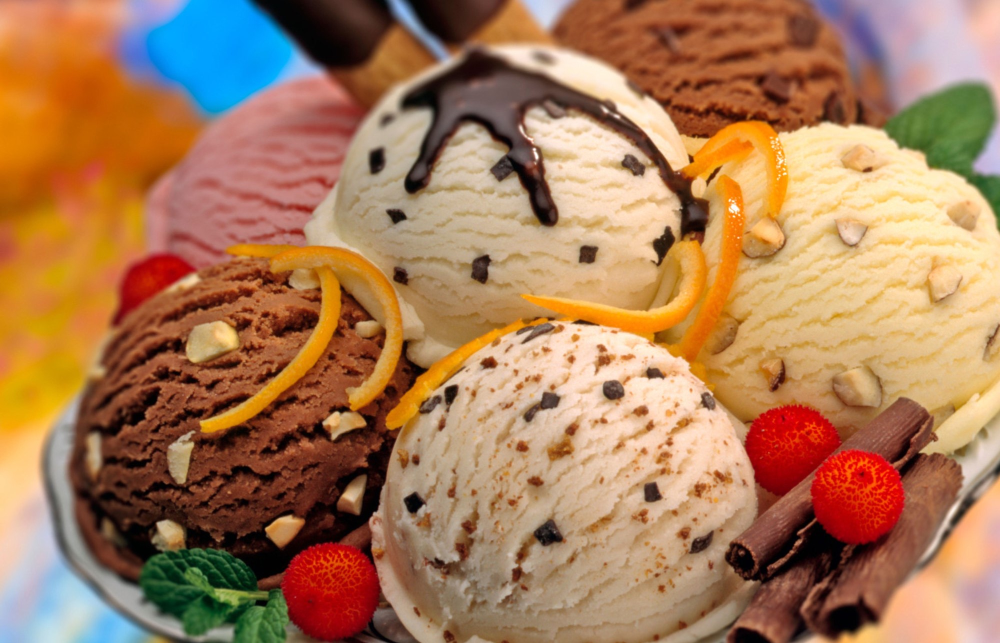 Assortment of ice cream scoops with toppings HD Wallpaper