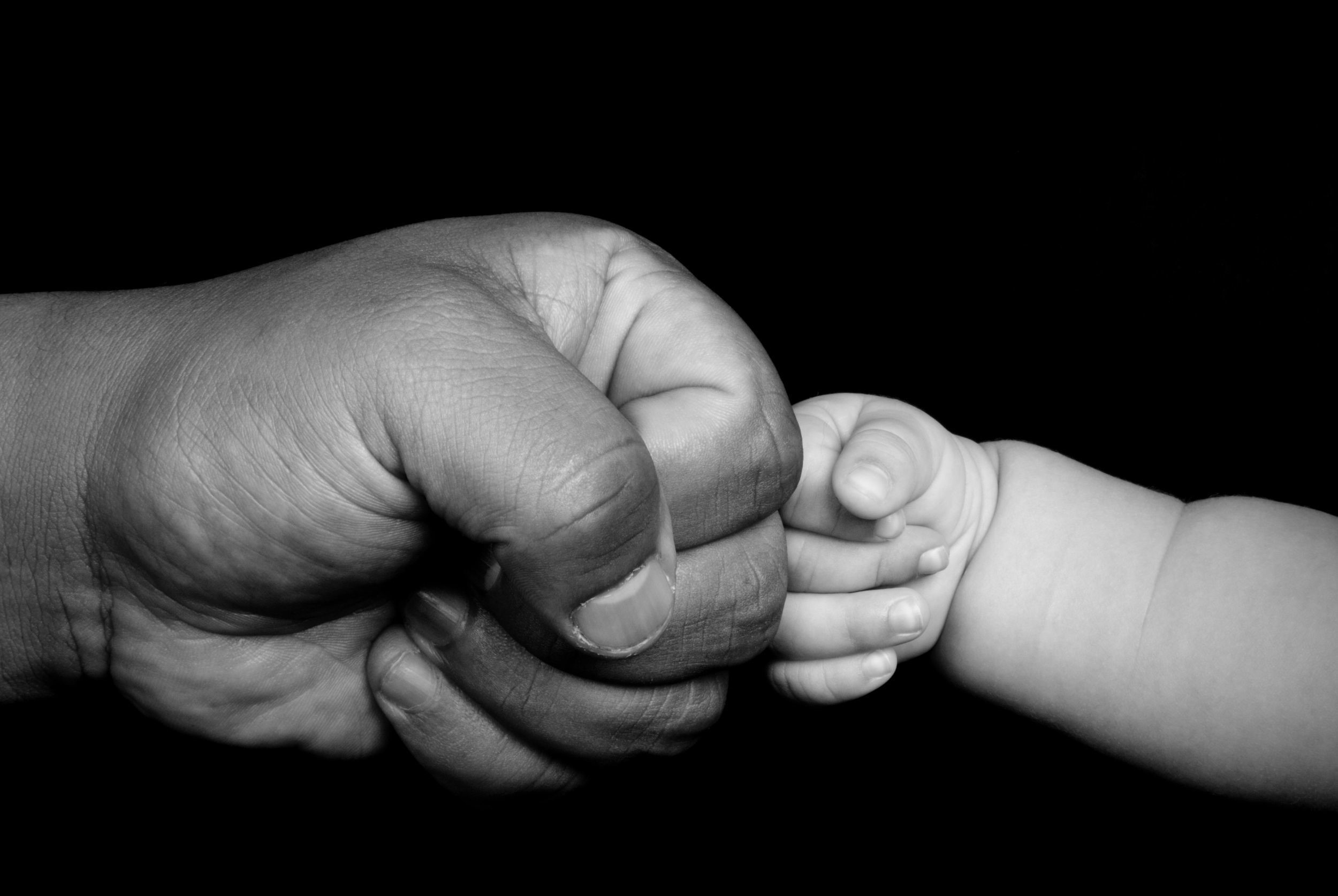 Adult hand holding a baby's hand HD Wallpaper