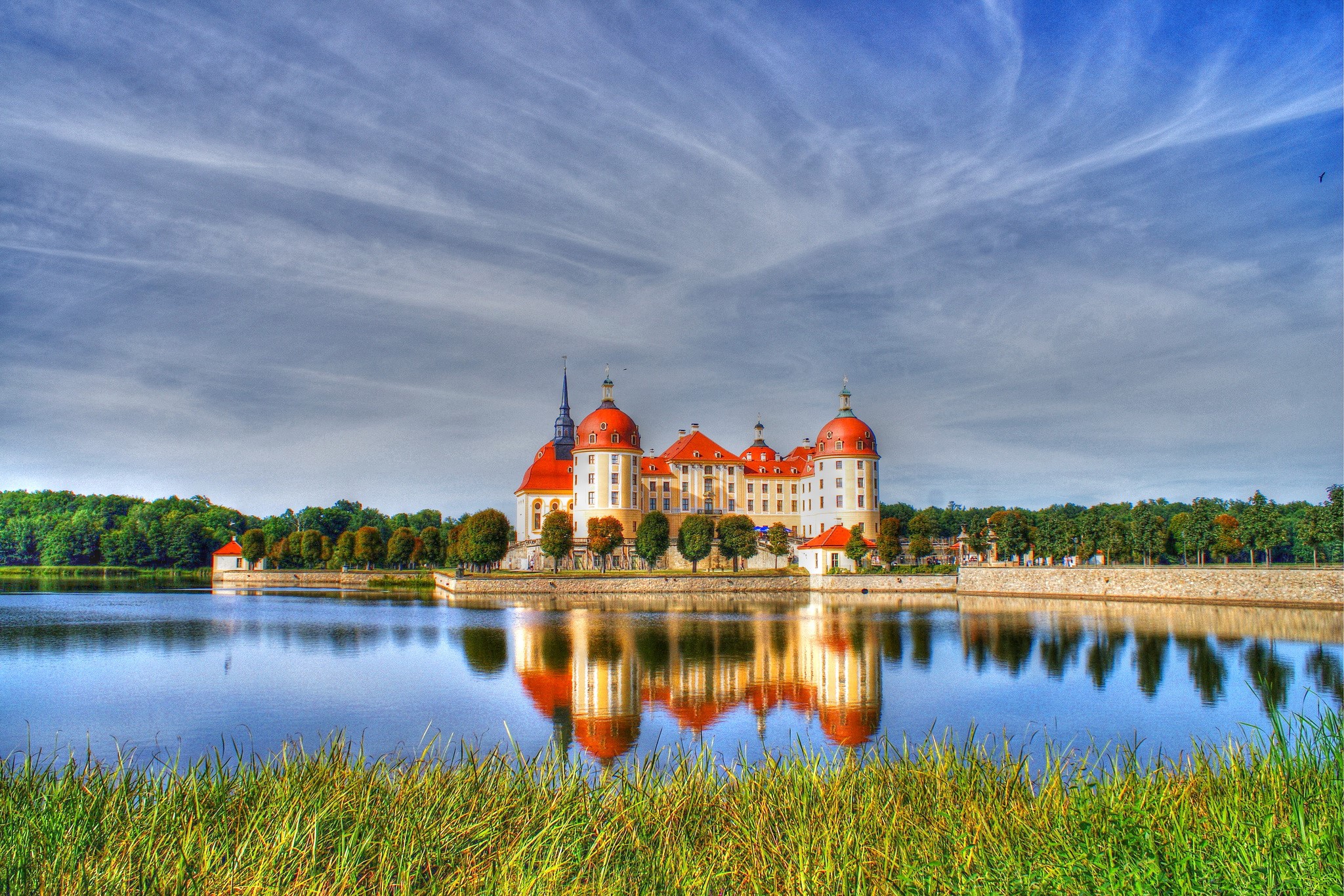 Moritzburg Castle reflected in water under a cloudy sky HD Wallpaper