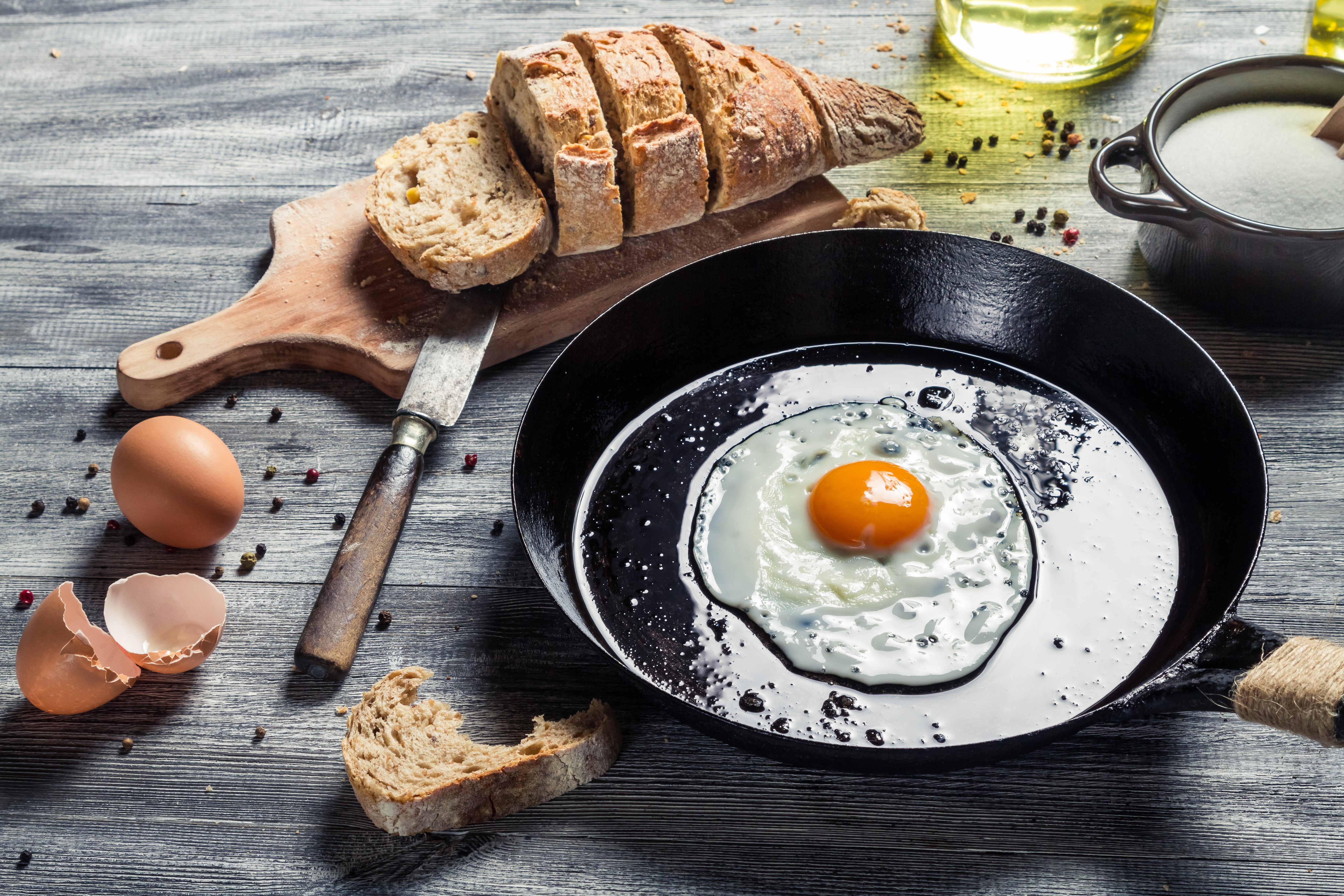 Fried egg in a pan with bread and eggs HD Wallpaper