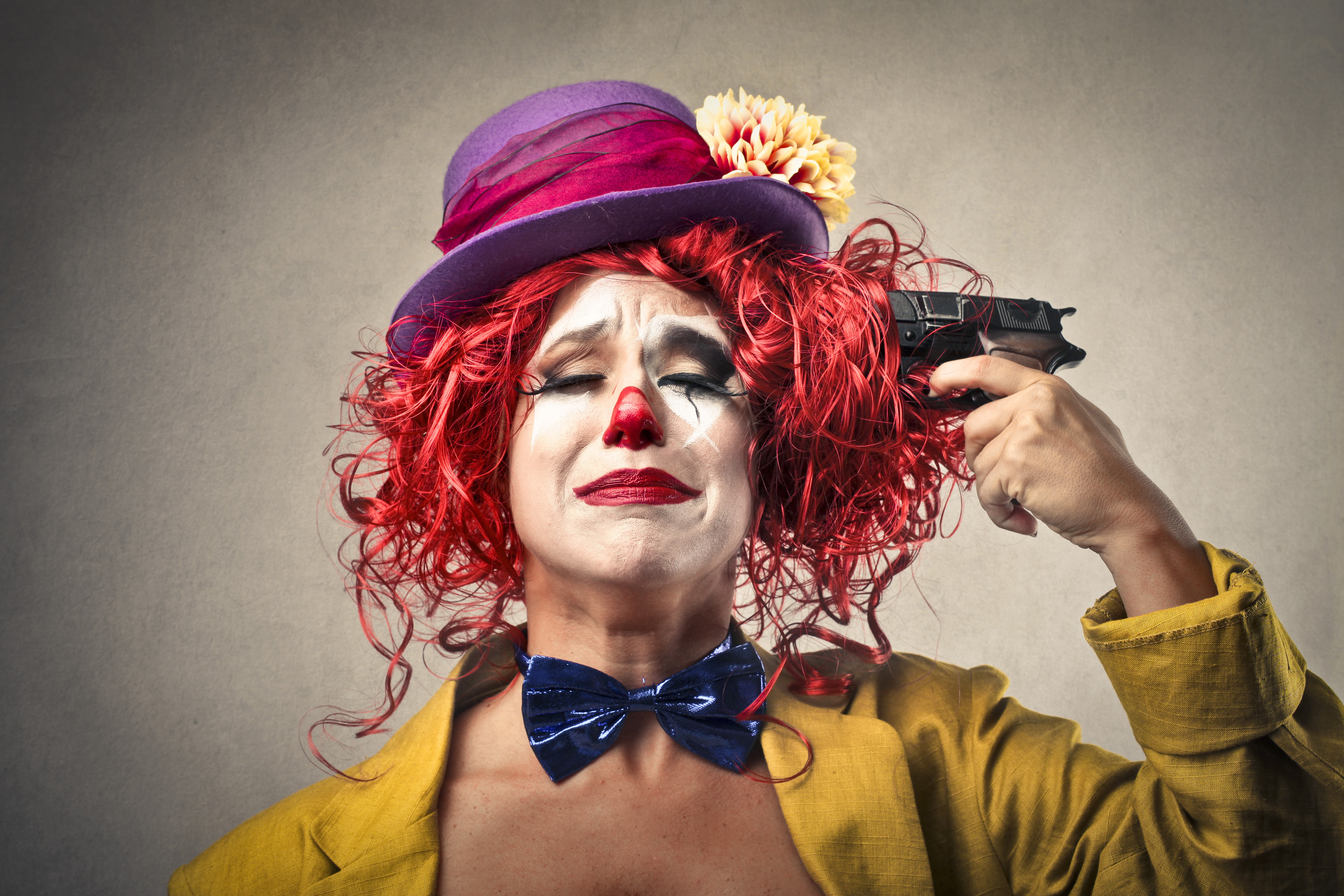 Clown with pistol to head HD Wallpaper