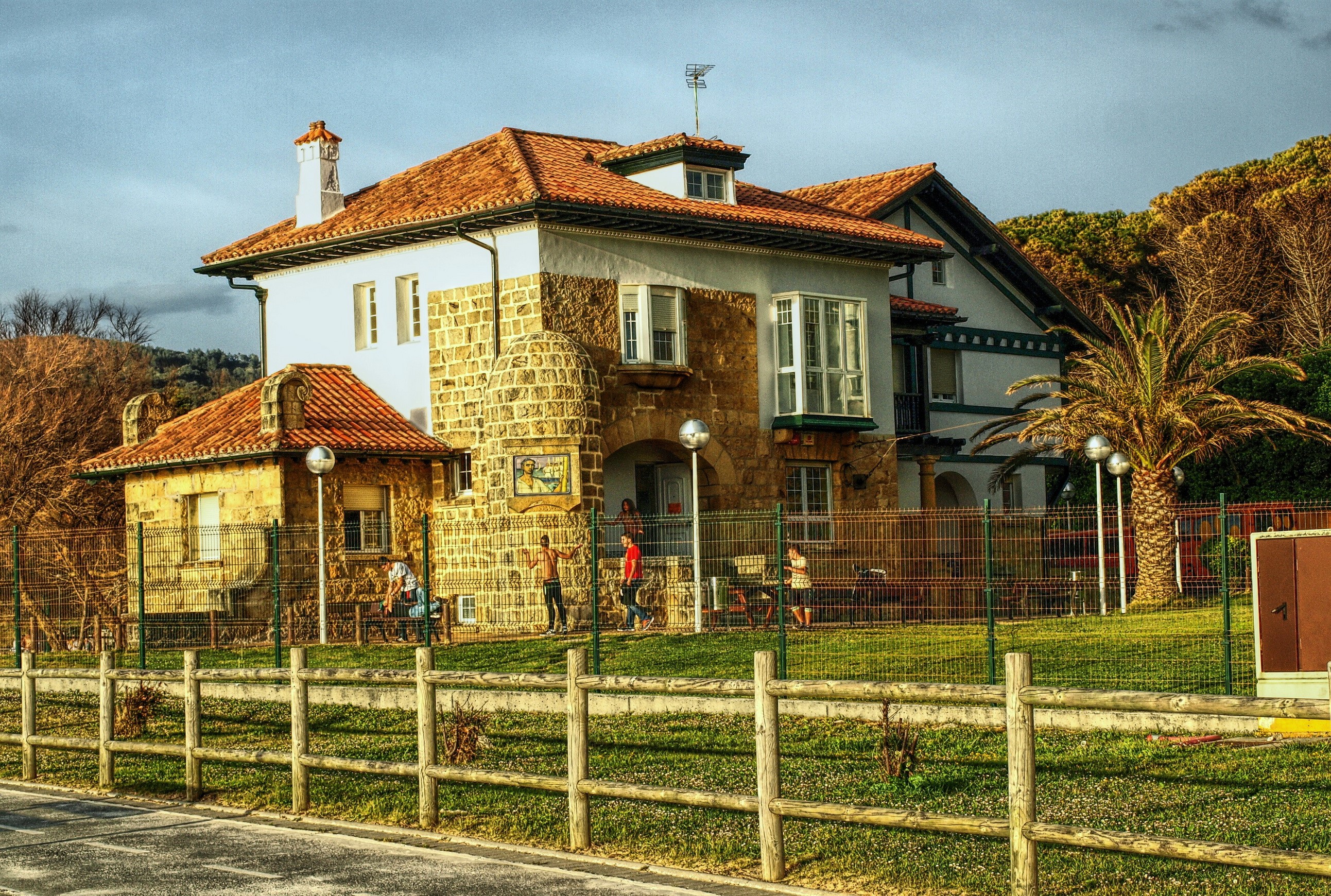 Houses in Plentzia, Spain with fence and grass HD Wallpaper