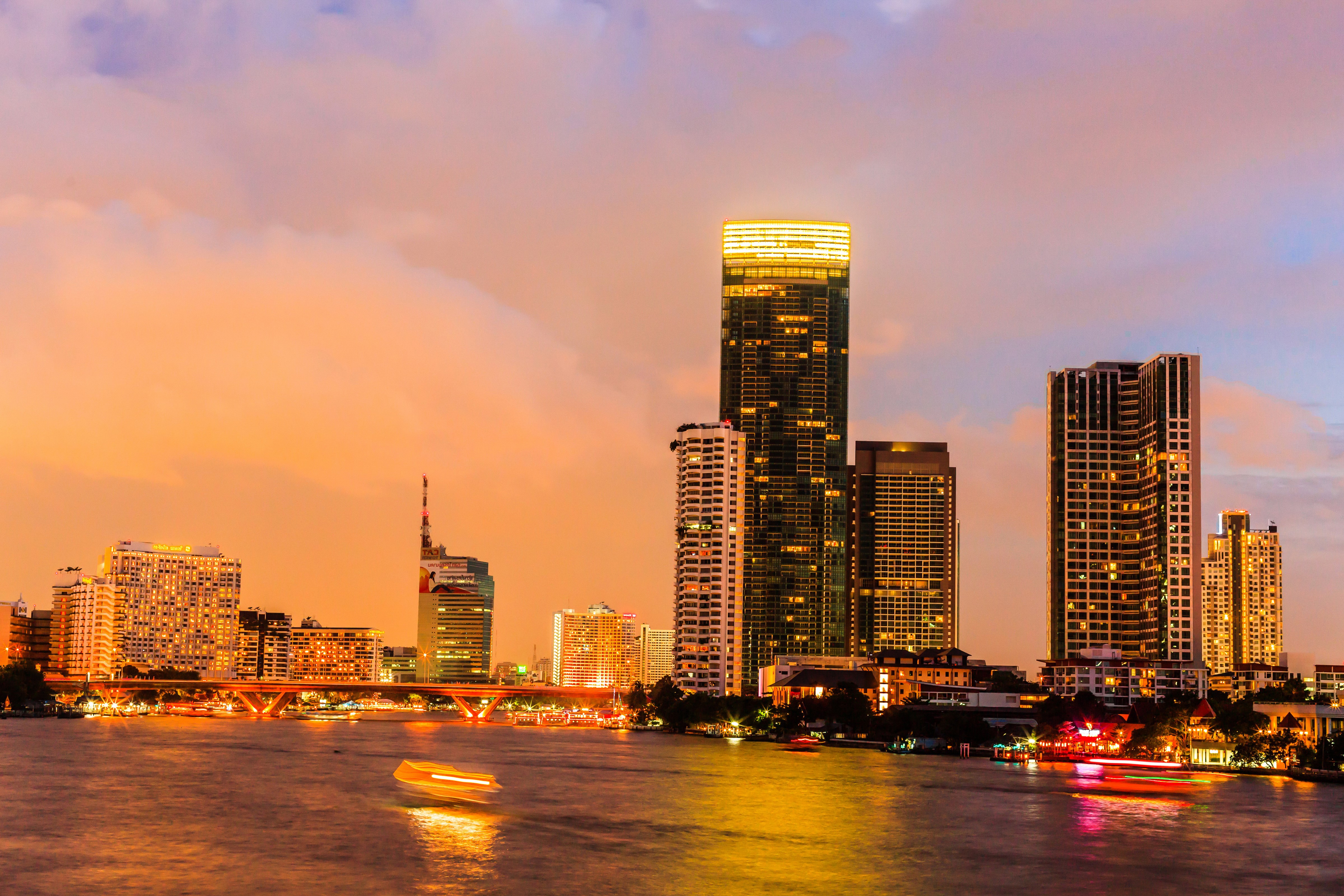 Bangkok Cityscape with River and Skyscrapers at Dusk HD Wallpaper