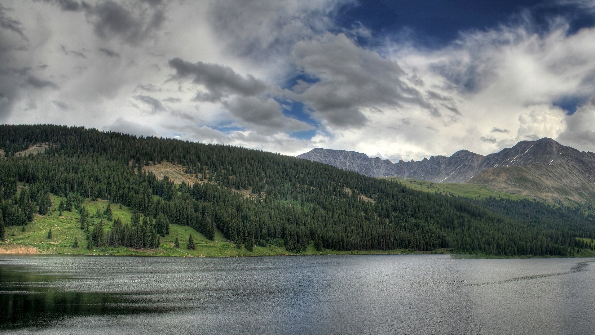 Lake and Forested Mountains Under Cloudy Sky HD Wallpaper