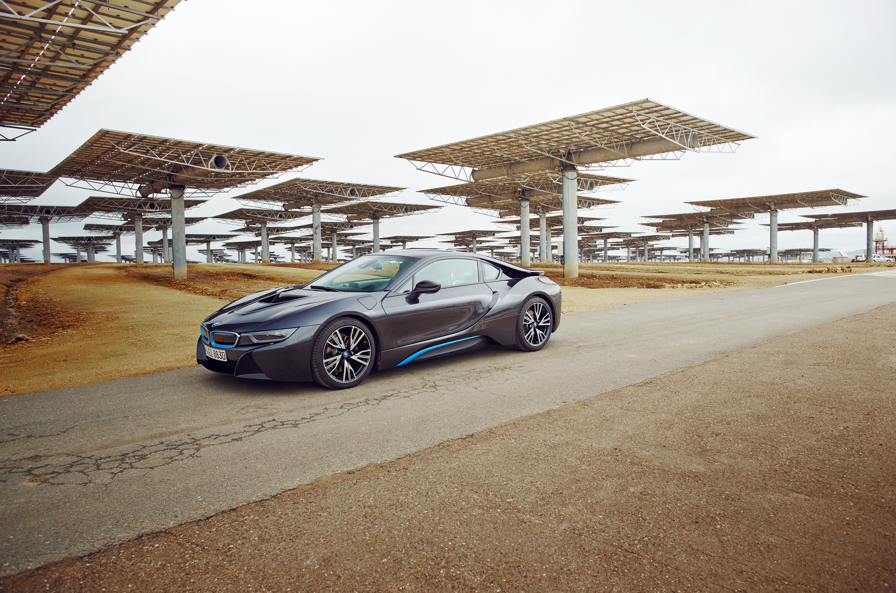Grey 2015 BMW i8 parked near solar panels HD Wallpaper