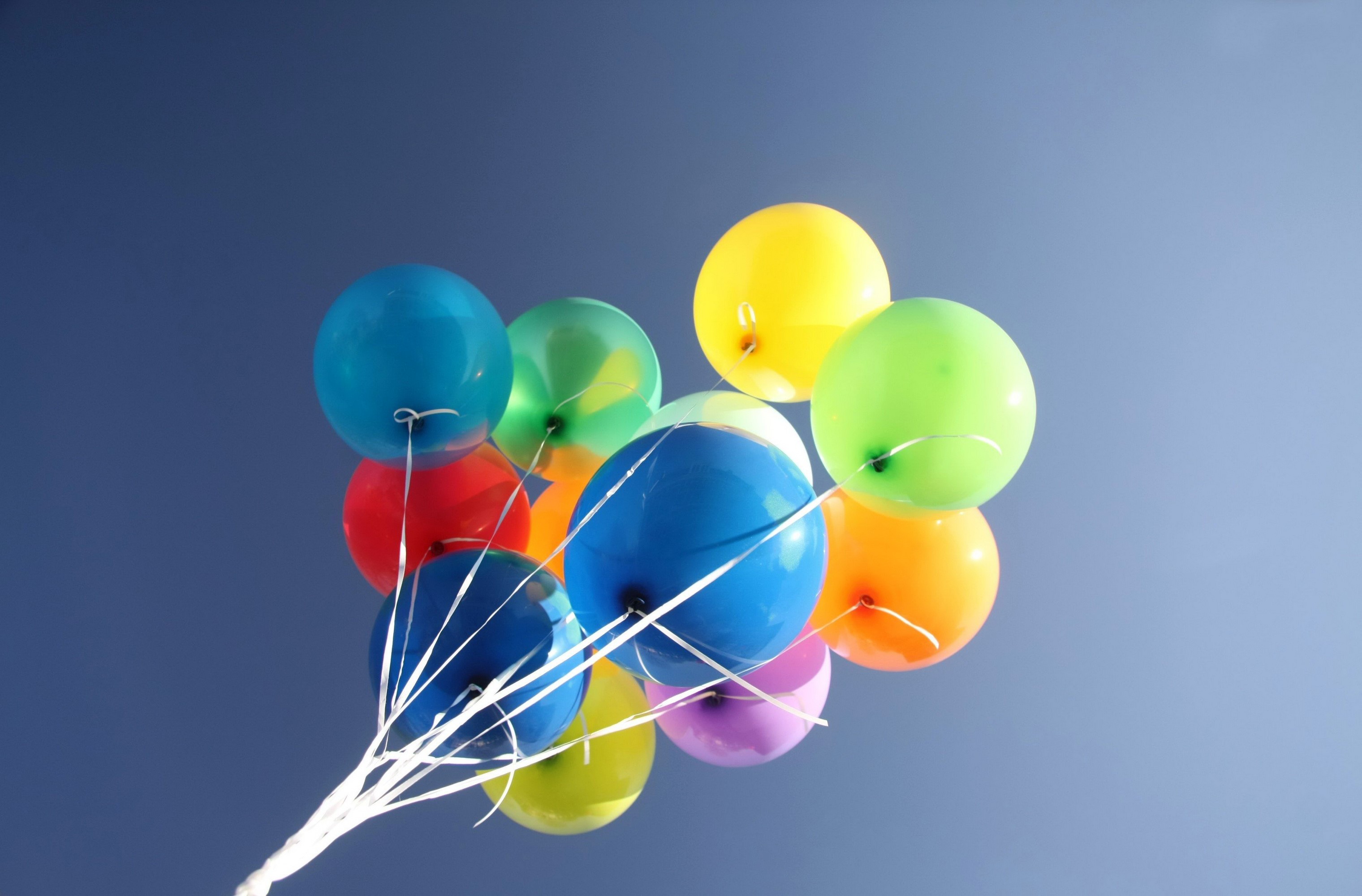 A bunch of colorful balloons floating in the sky HD Wallpaper