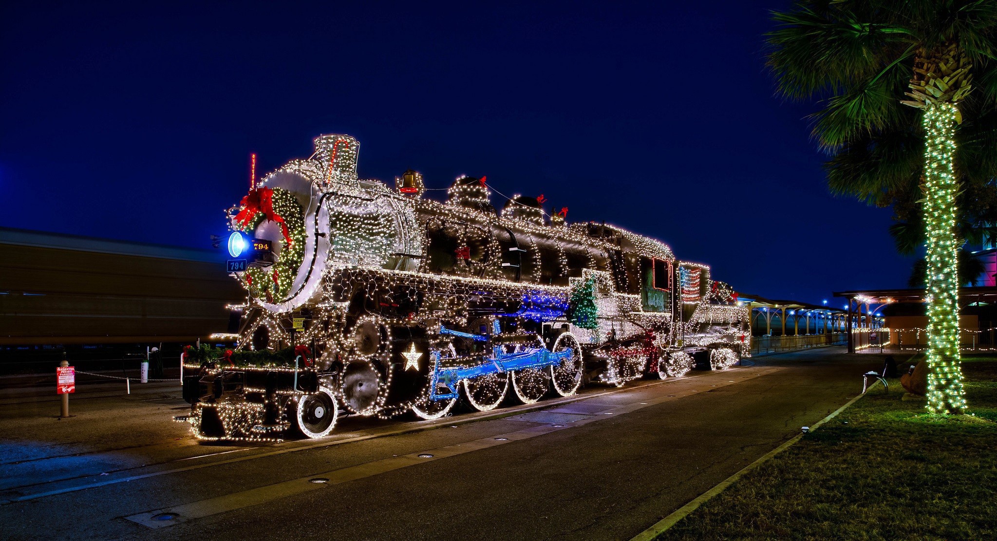 Steam locomotive decorated with Christmas lights HD Wallpaper