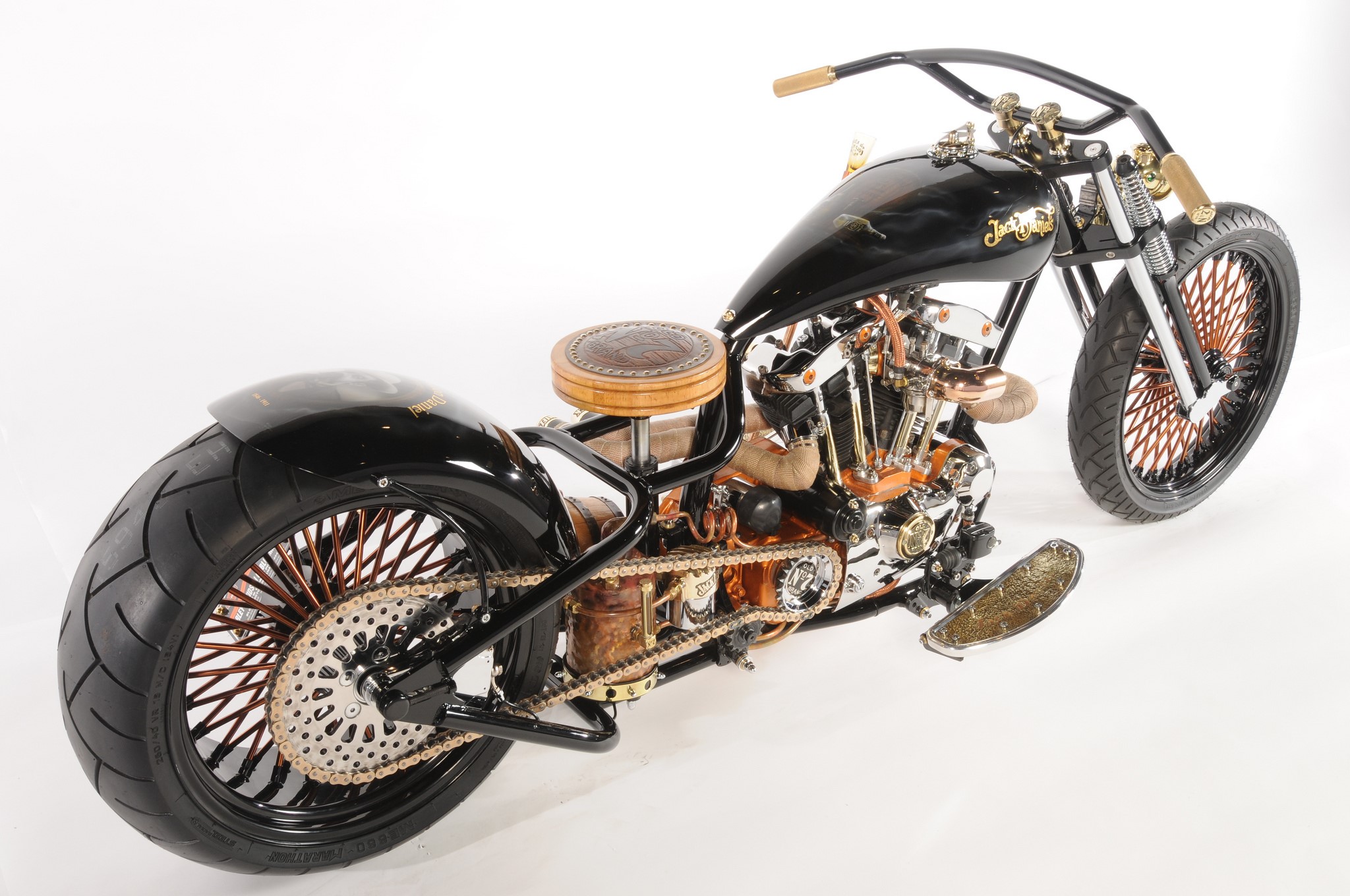Customized black chopper motorcycle with copper accents HD Wallpaper