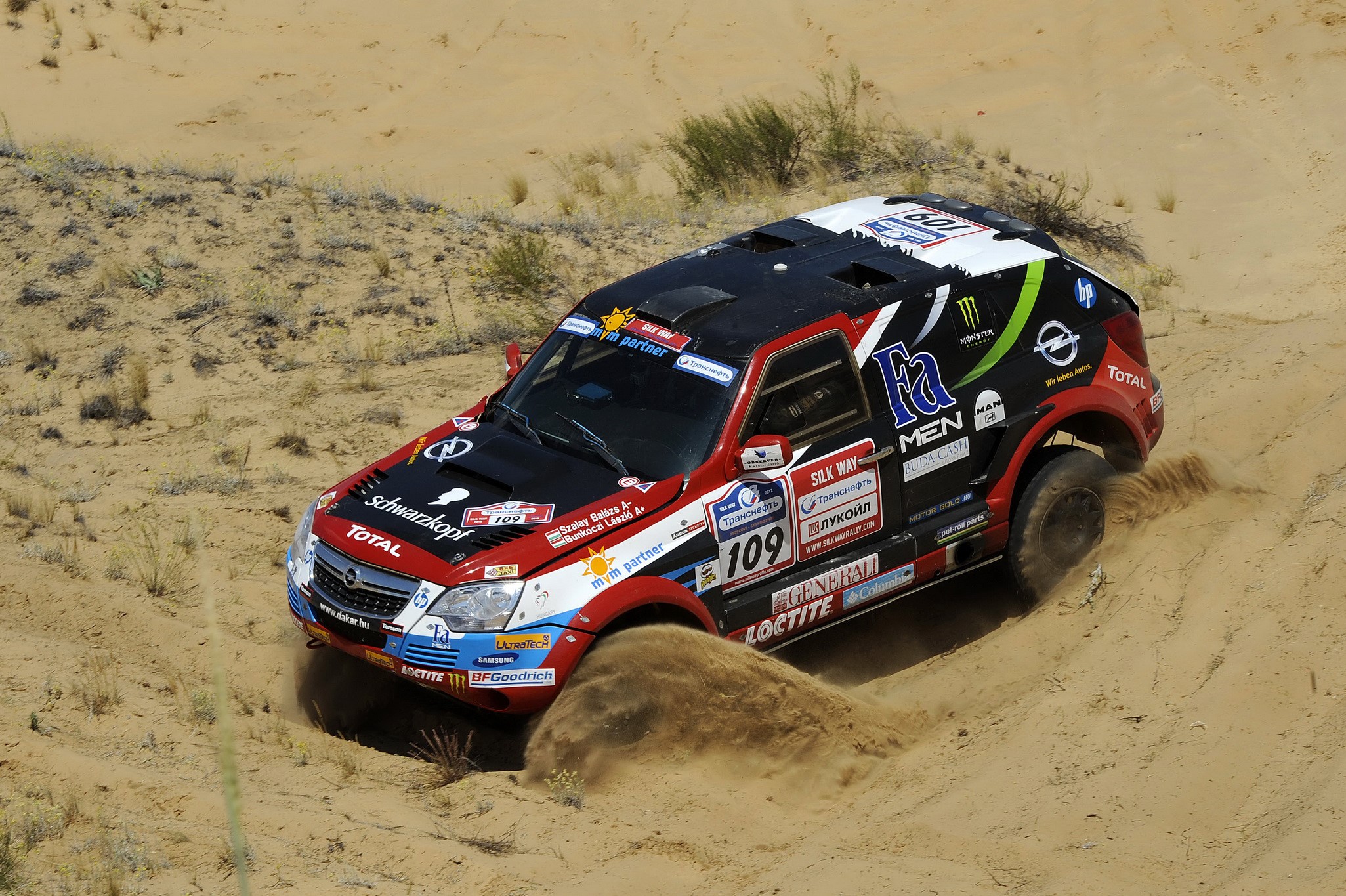 Opel Antara rally car driving through sand HD Wallpaper