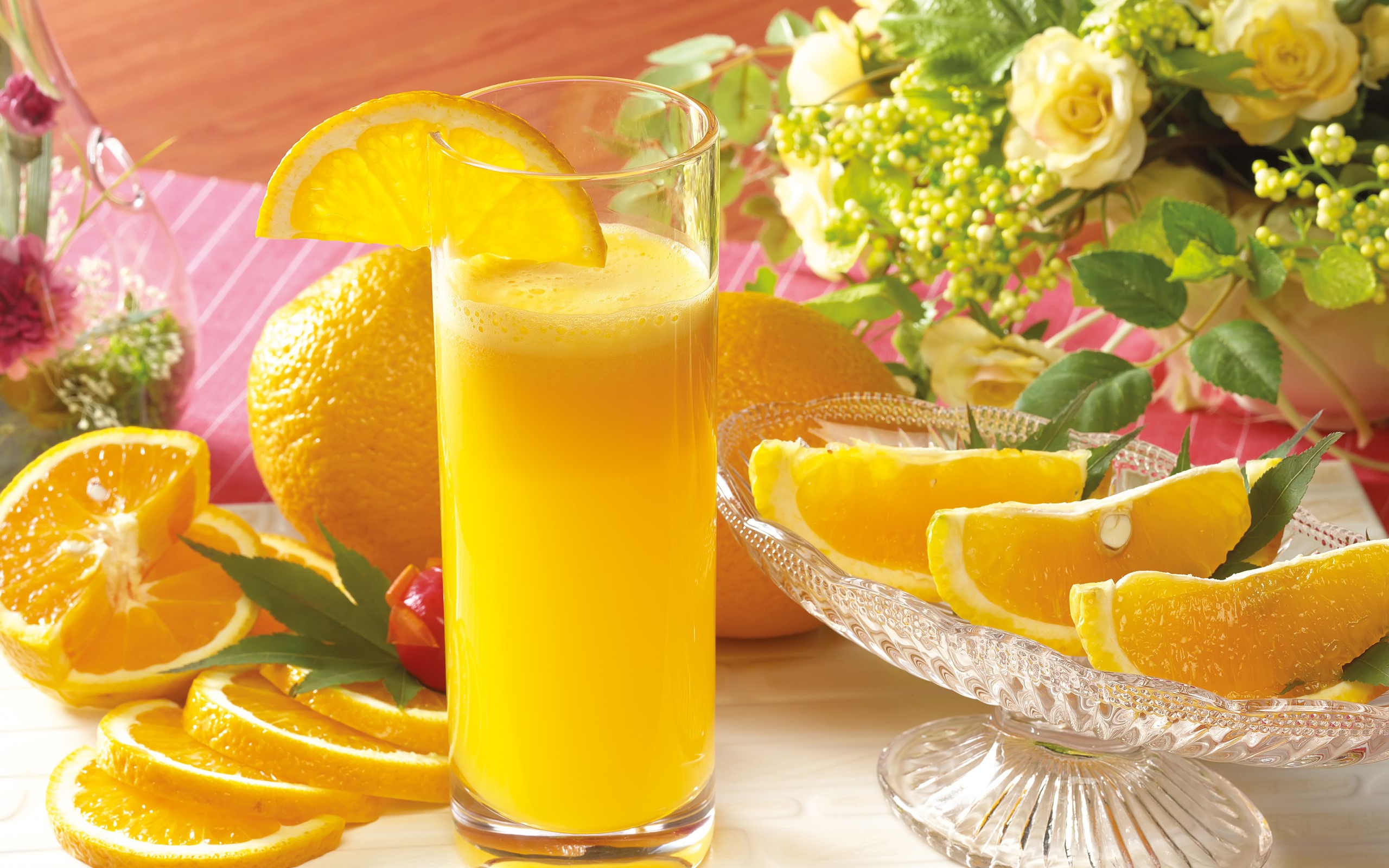 Orange juice with oranges and flowers HD Wallpaper
