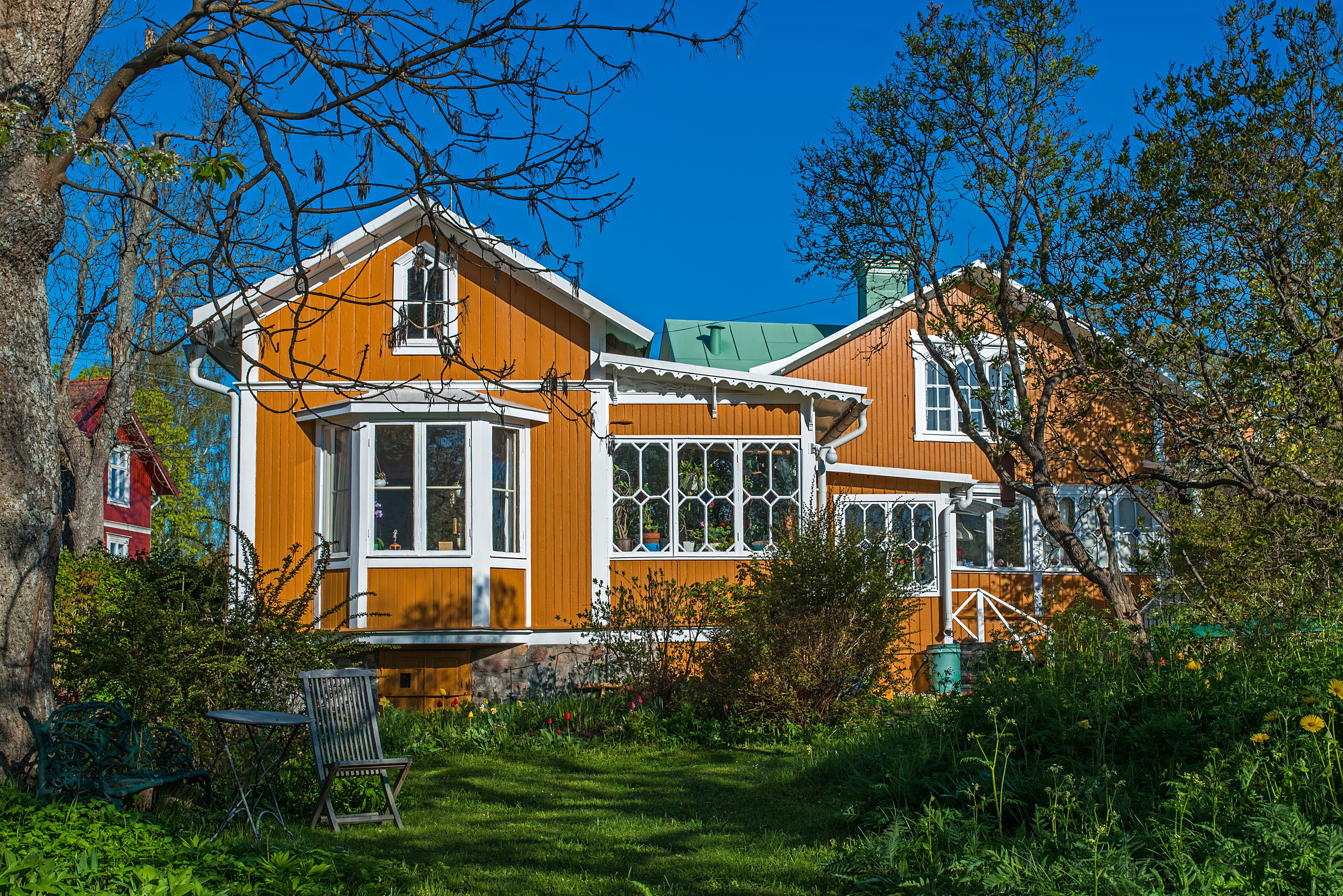 Orange houses in Vaxholm, Sweden with garden HD Wallpaper