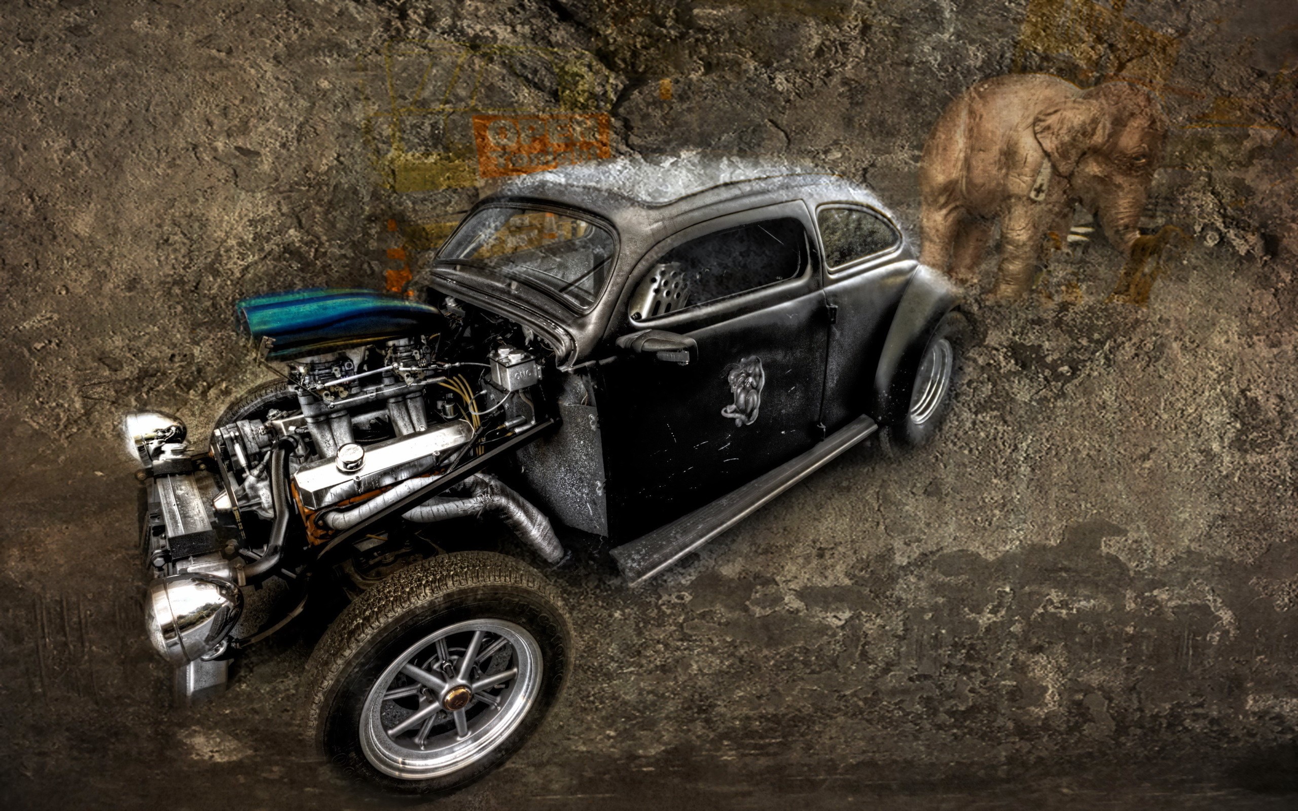 Modified vintage car with exposed engine and elephant silhouette HD Wallpaper