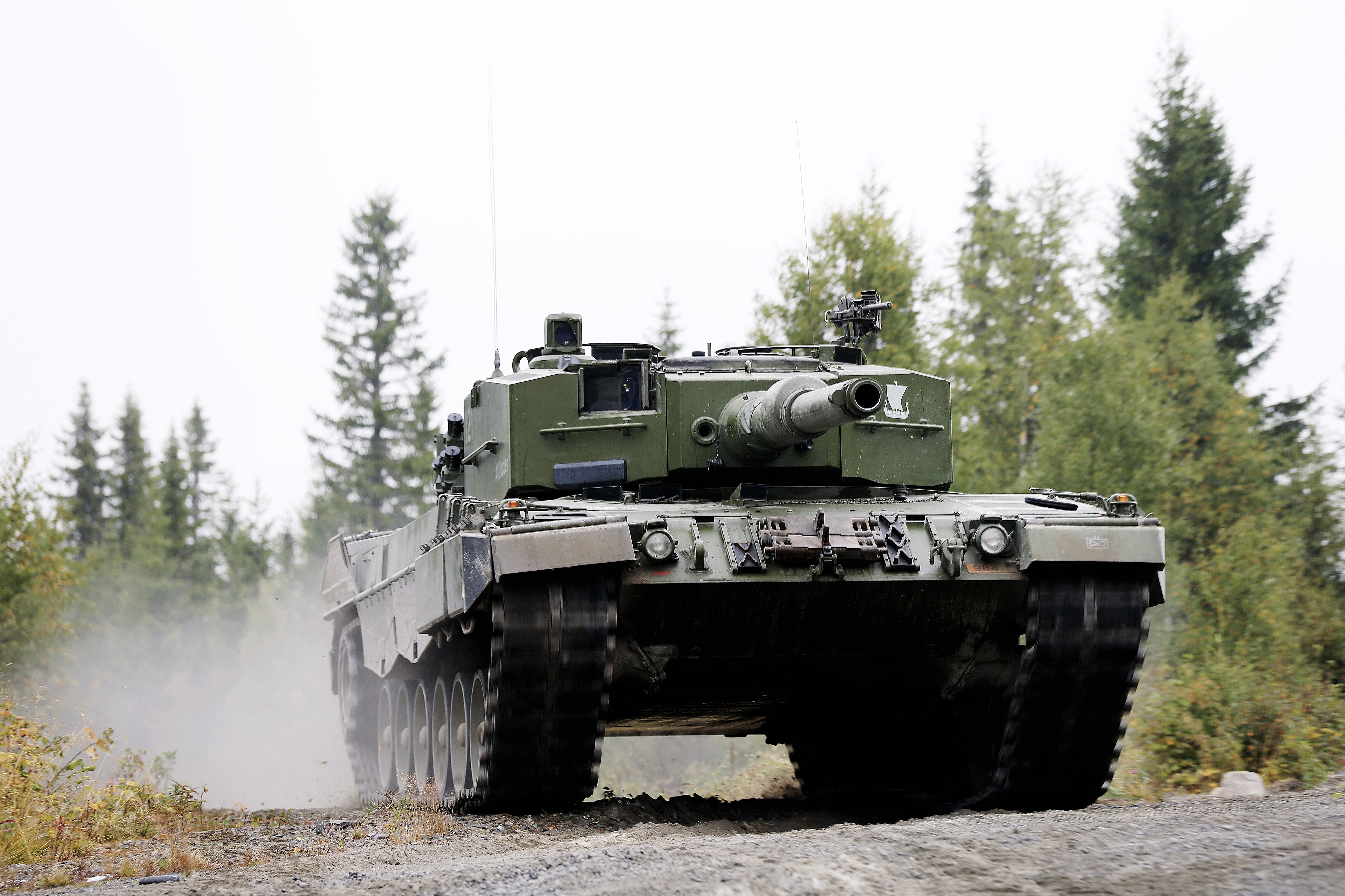 Norwegian Leopard 2 A4 tank driving on a dirt road HD Wallpaper