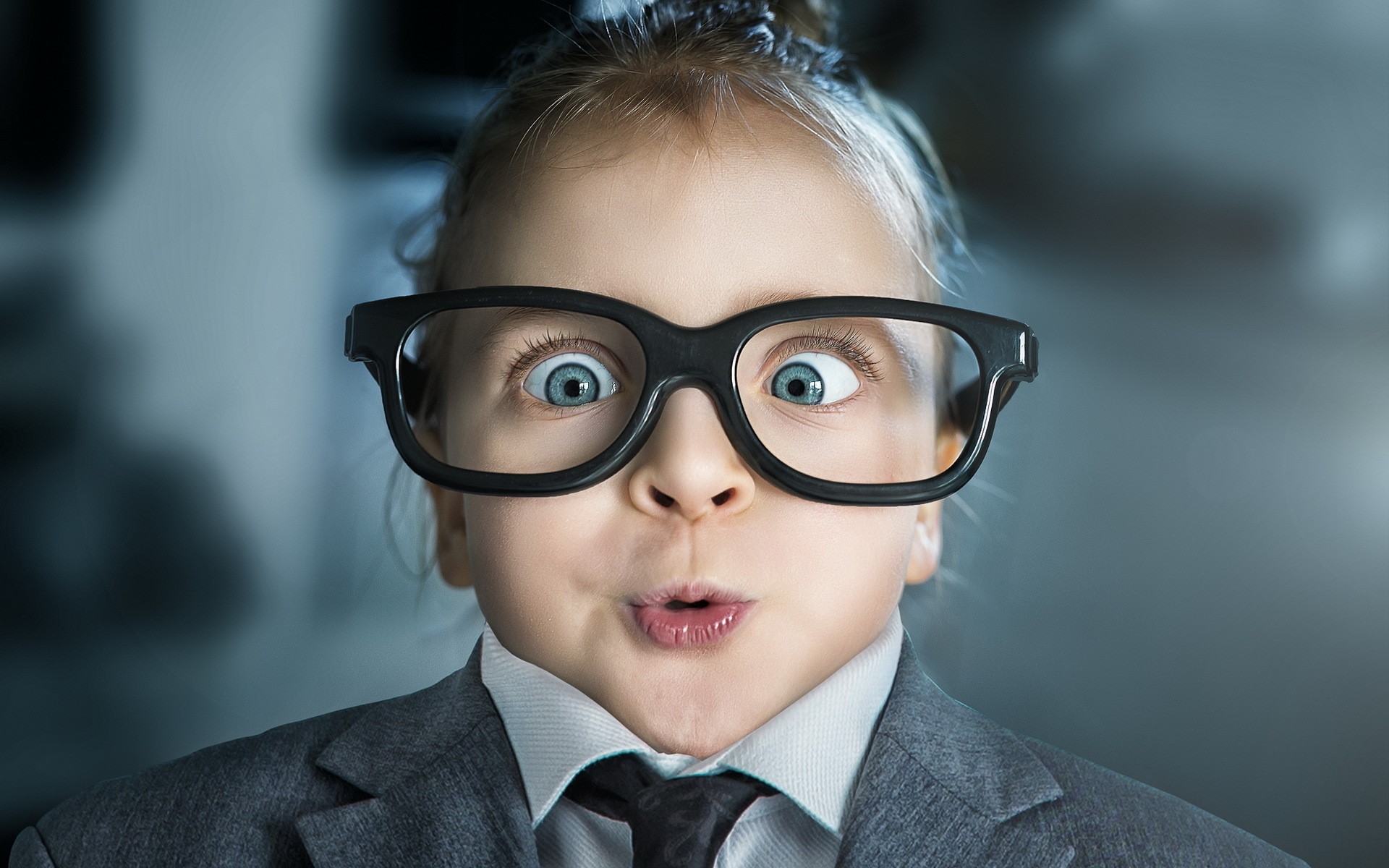 Young girl wearing glasses and a suit HD Wallpaper