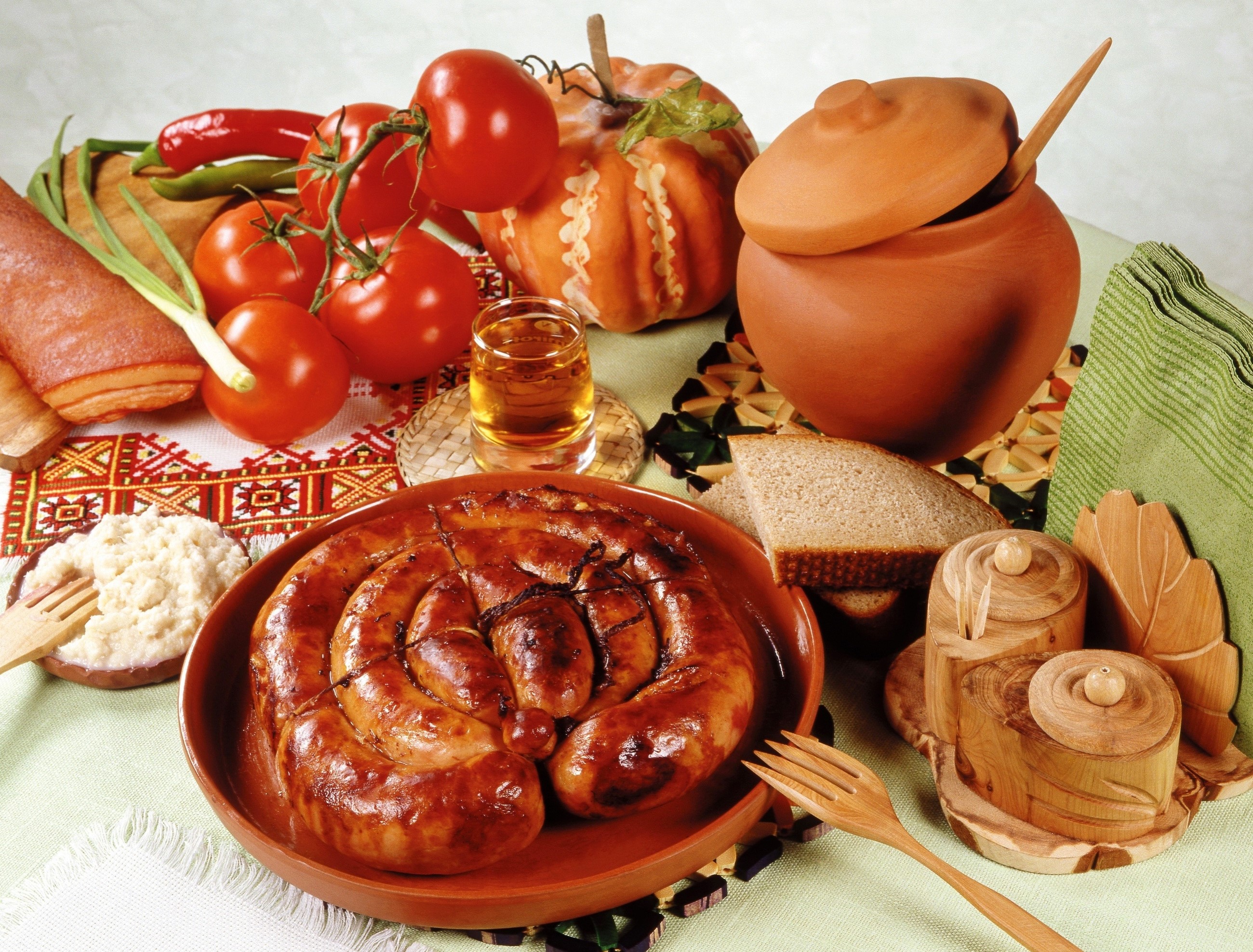 Still-life with sausage, tomatoes, bread, and shot glass HD Wallpaper