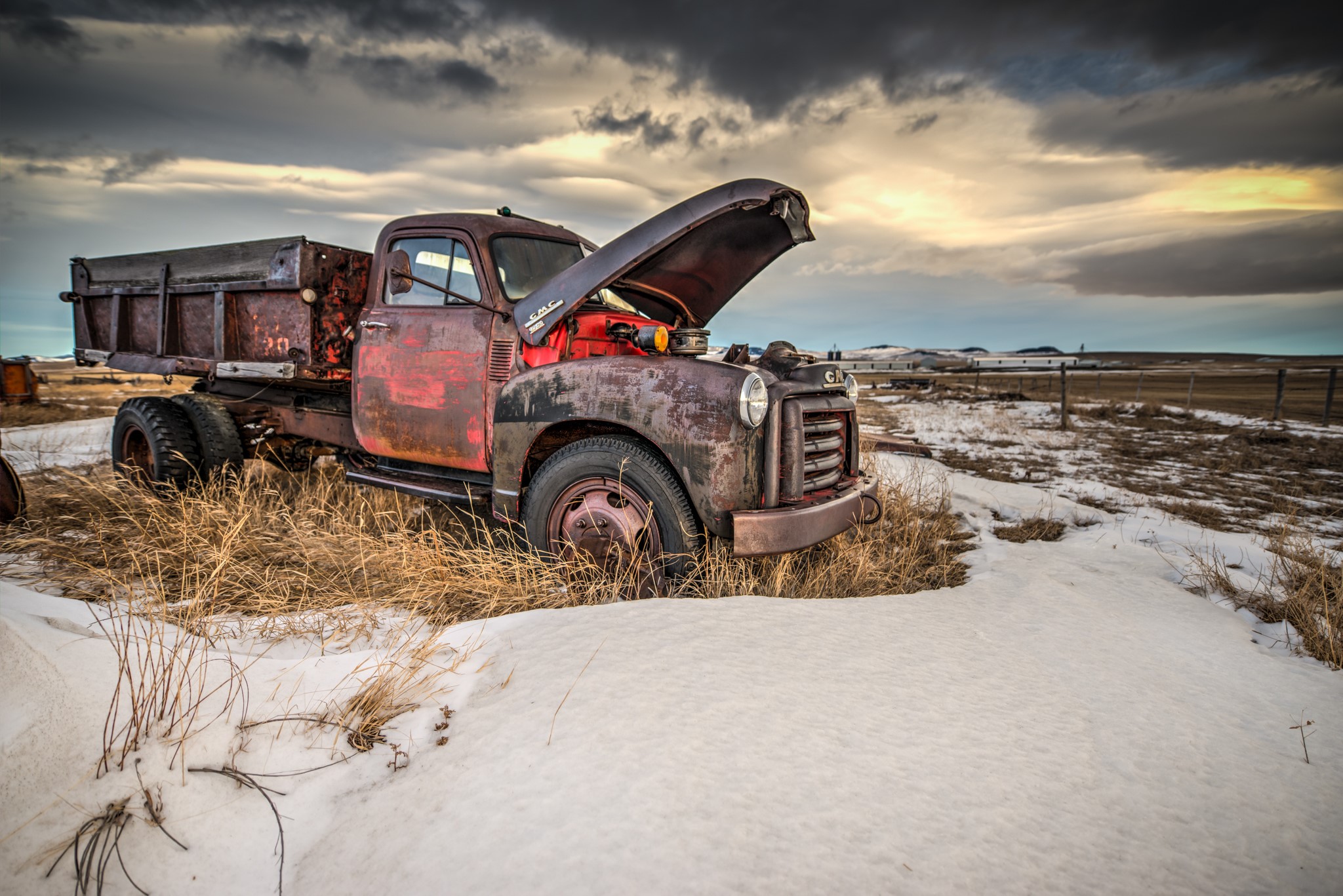 Old rusty GMC dump truck in snow HD Wallpaper