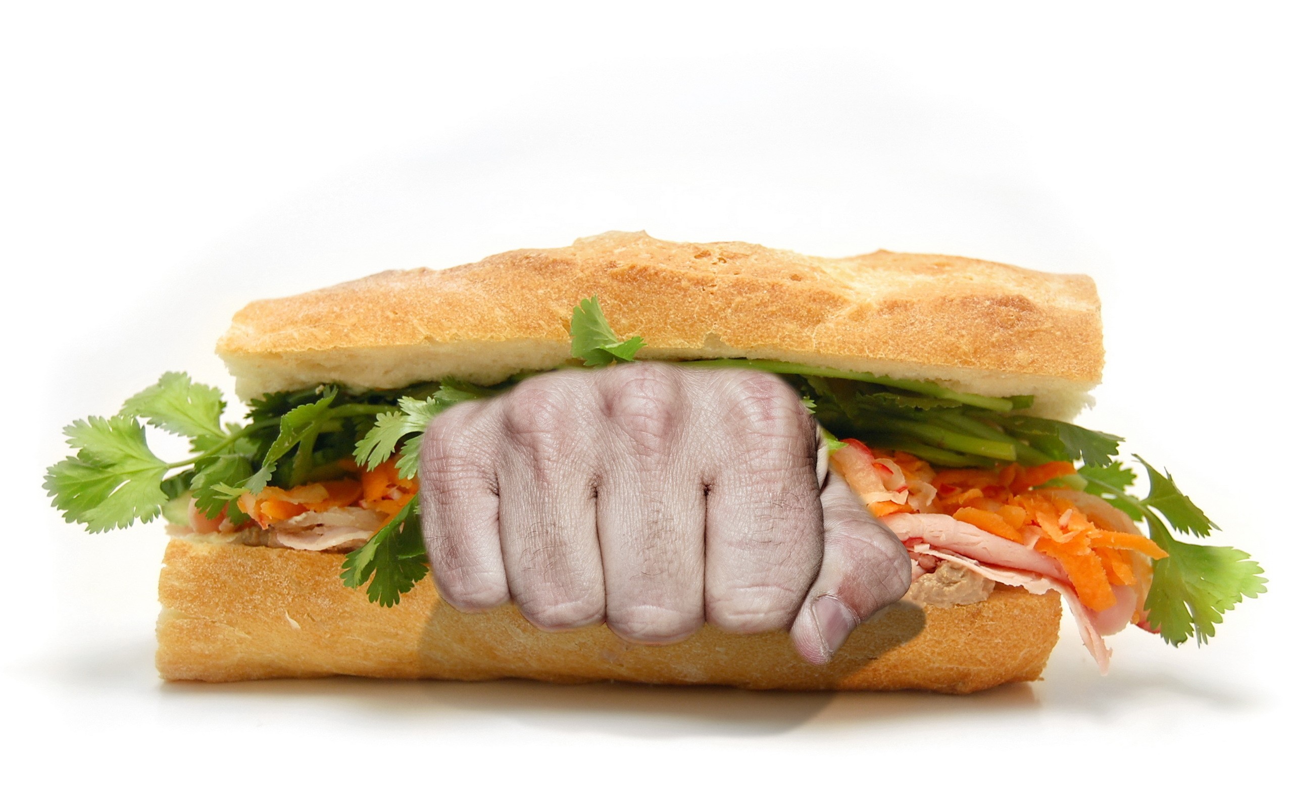 A fist punching through a sandwich HD Wallpaper