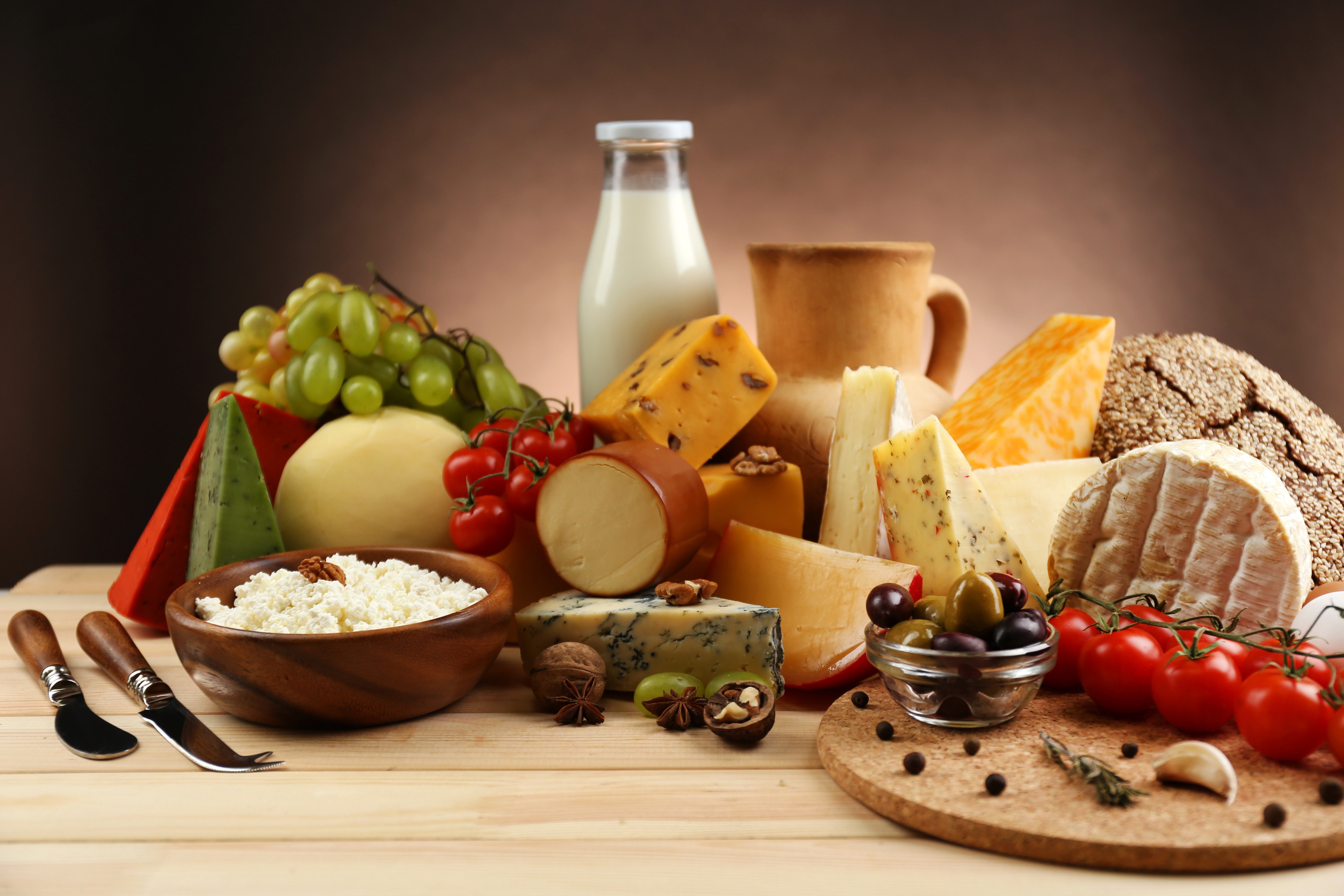 Still-life of cheese, milk, tomatoes, nuts, and grapes HD Wallpaper