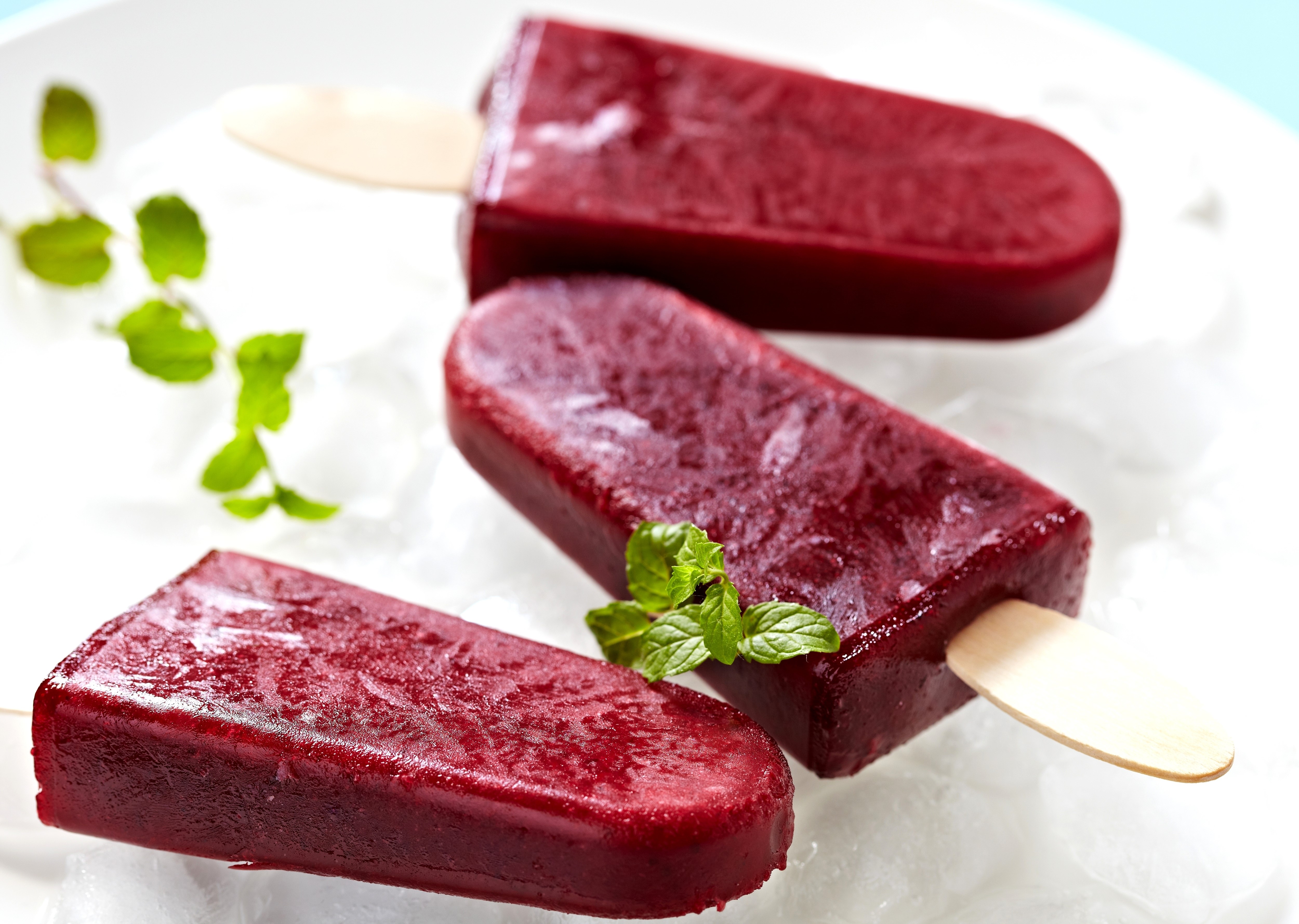 Three berry popsicles on ice HD Wallpaper