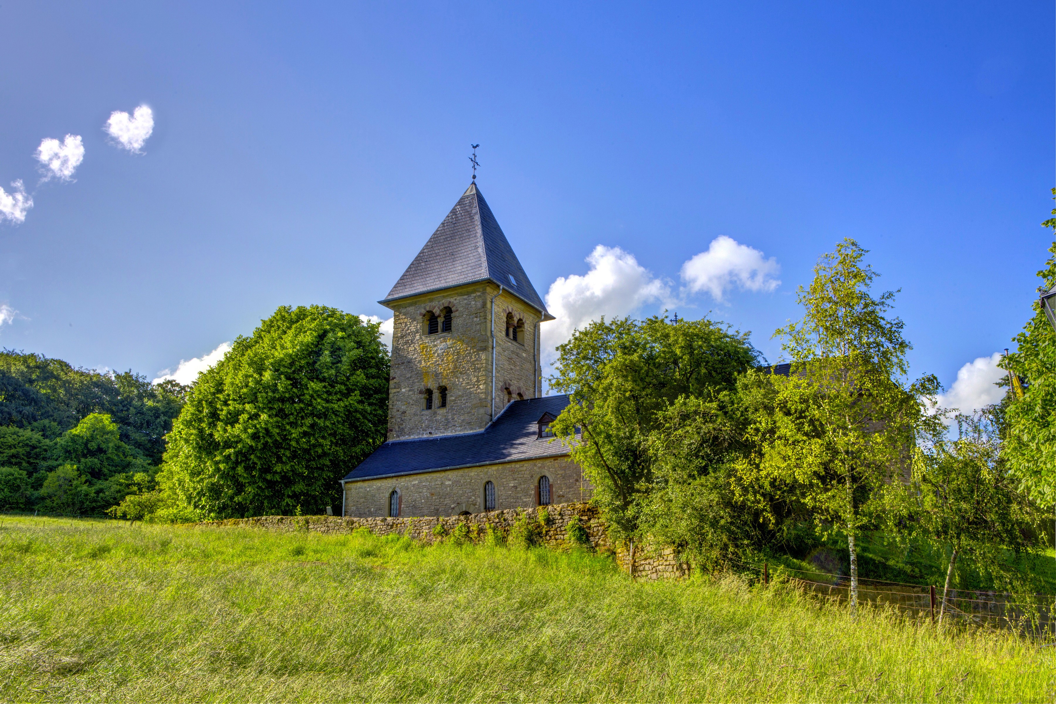 Girsterklaus Church in Luxembourg surrounded by greenery HD Wallpaper