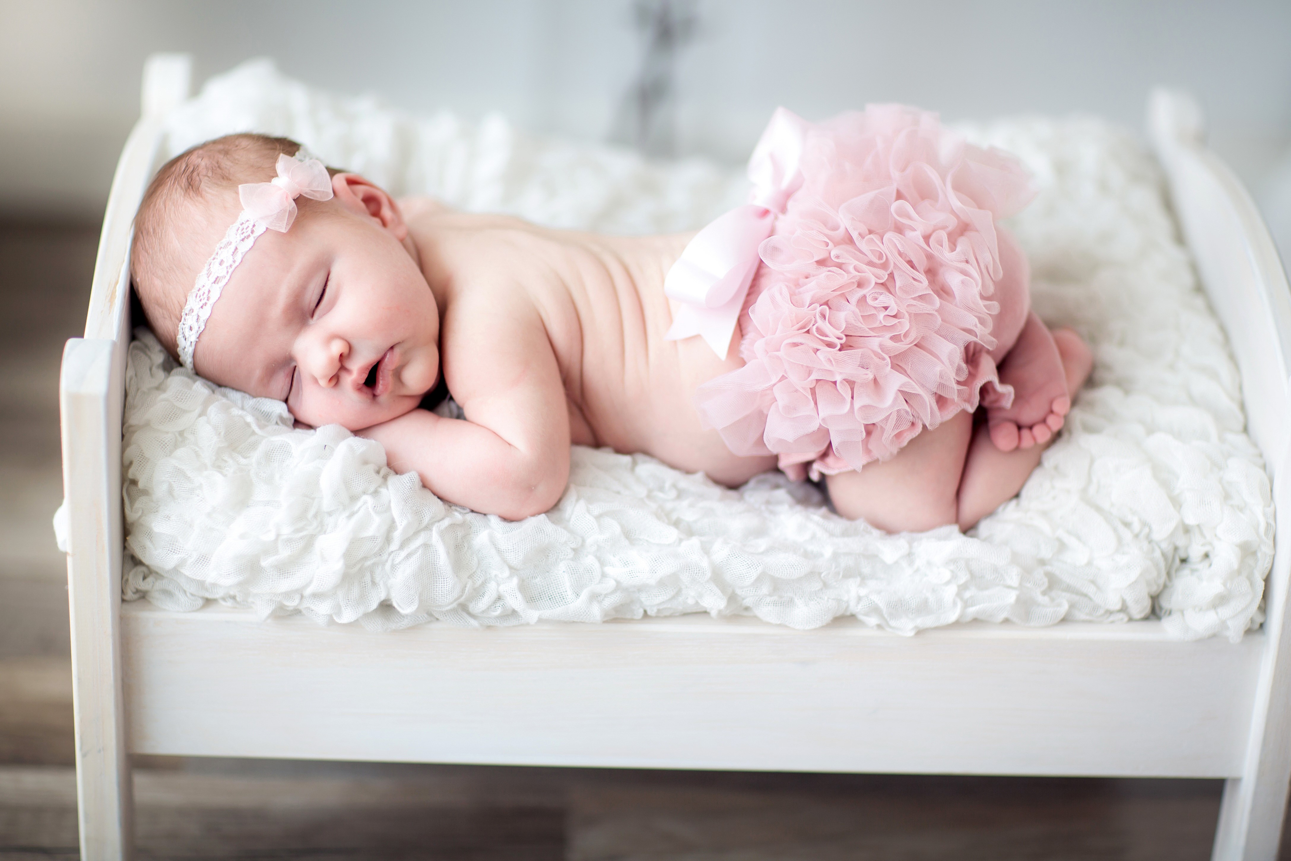 4K Newborn Baby Sleeping on a Bed HD Wallpaper
