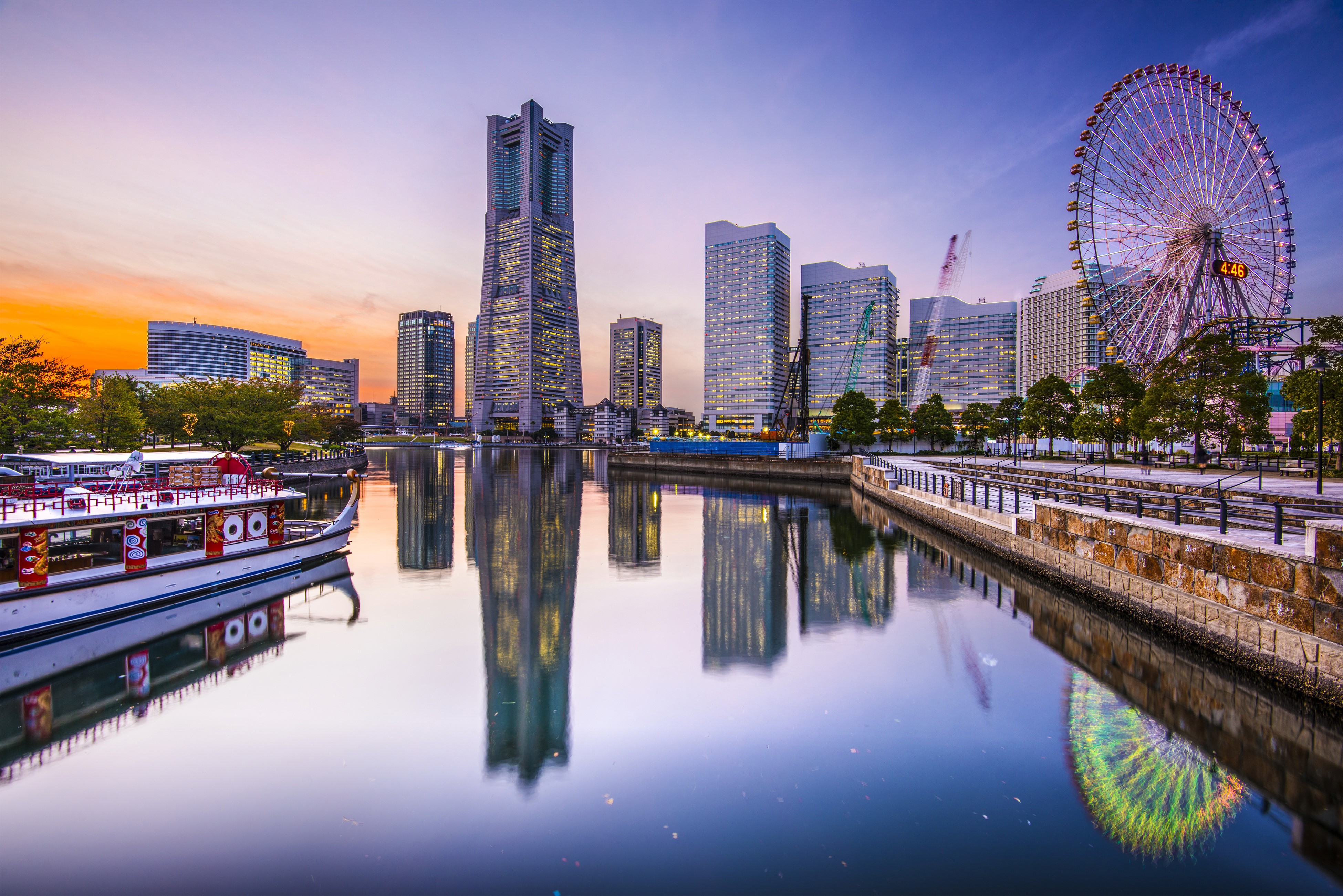 Yokohama skyline with Ferris wheel and boat at sunset HD Wallpaper