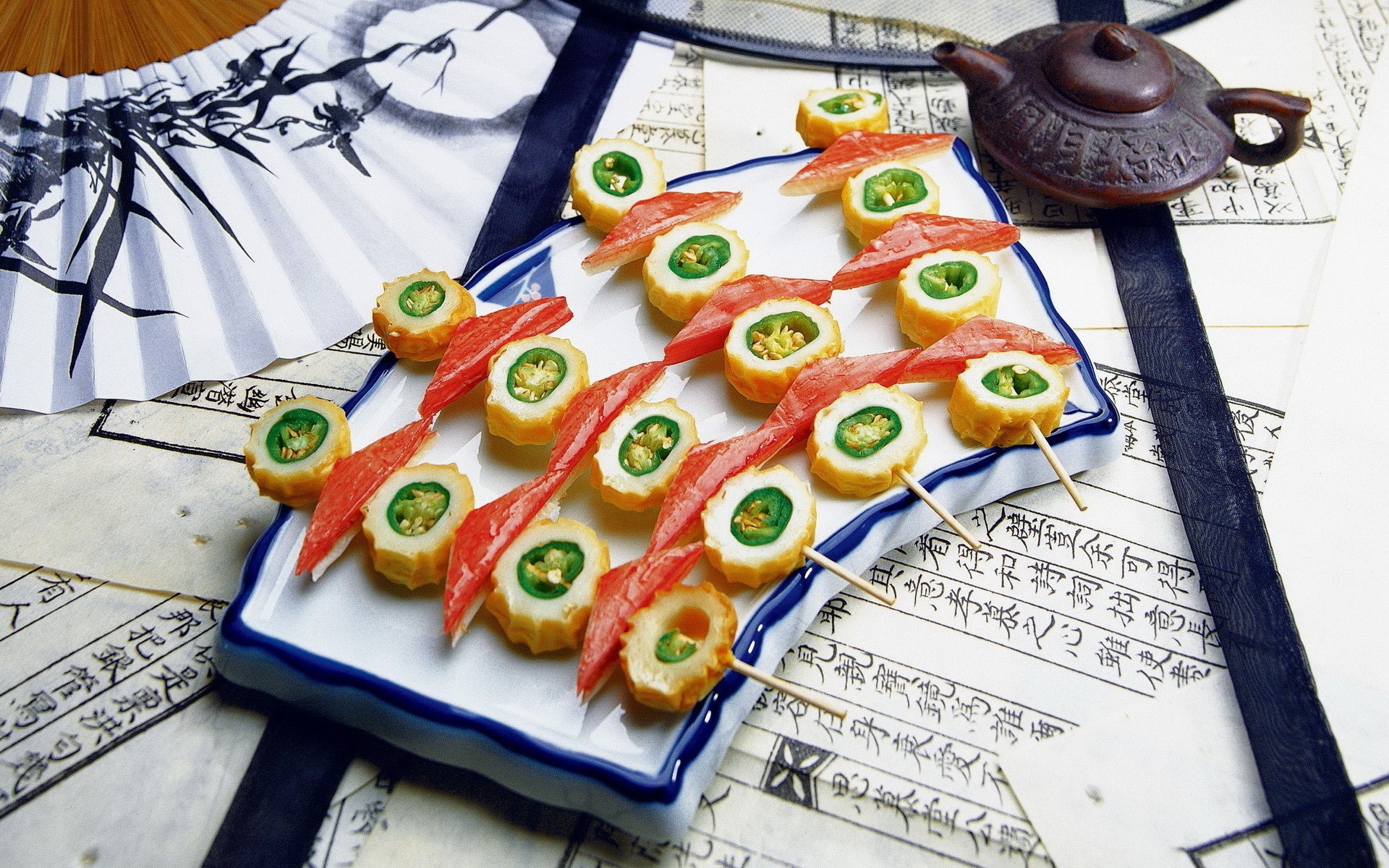 Sushi with crab sticks and green peppers on a plate HD Wallpaper
