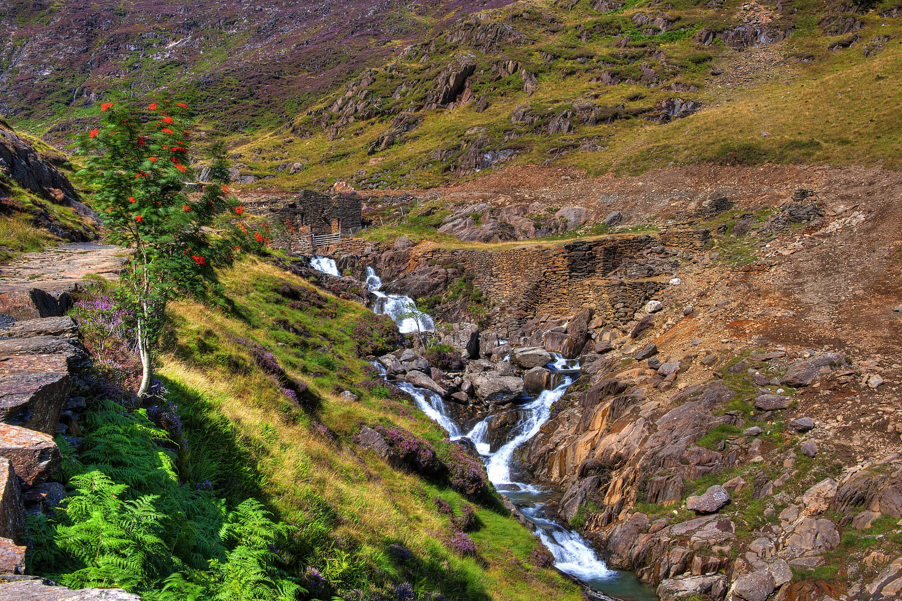Waterfall in a rocky mountain landscape in Snowdonia, UK HD Wallpaper