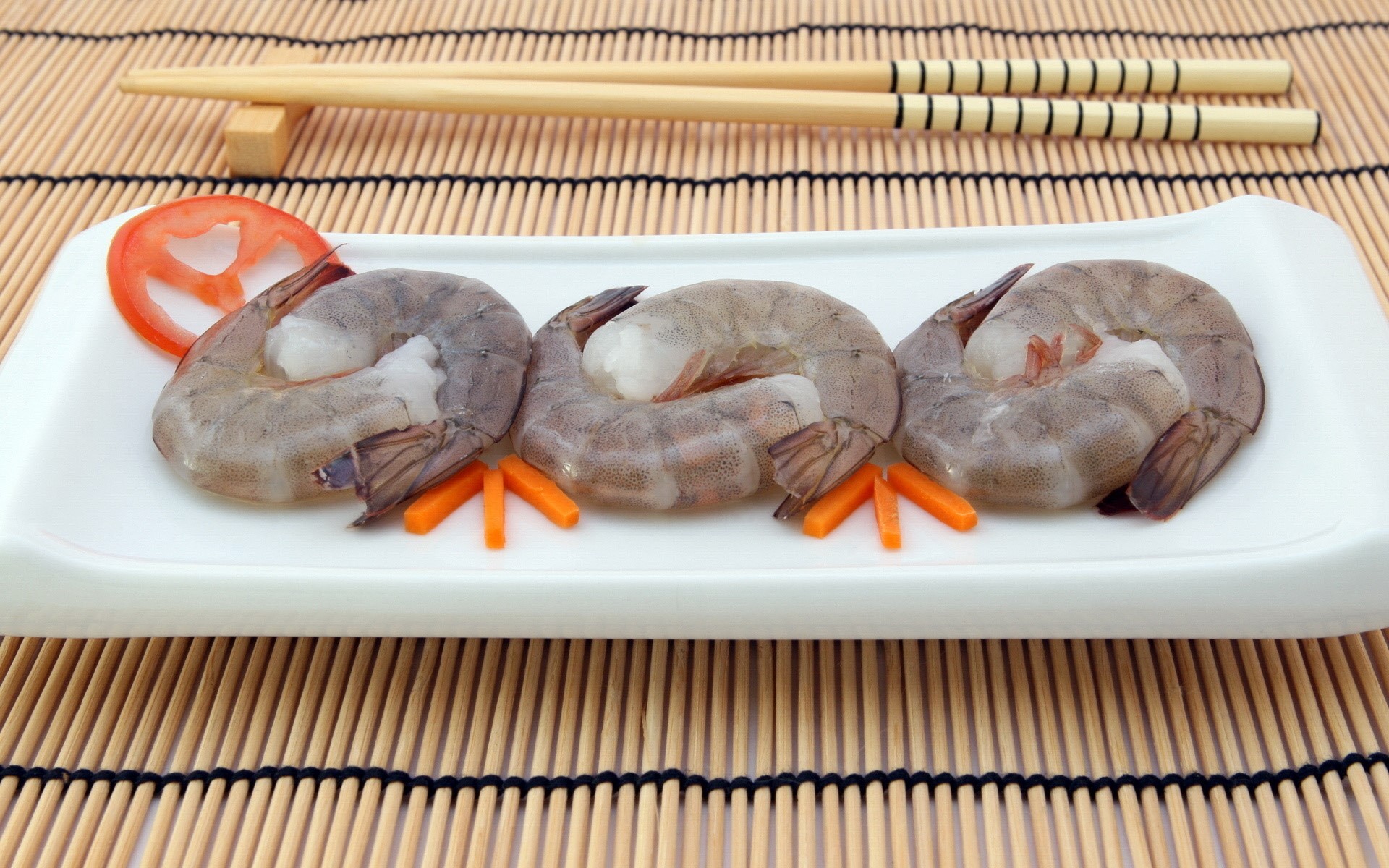 Three raw shrimp on a white plate with chopsticks HD Wallpaper