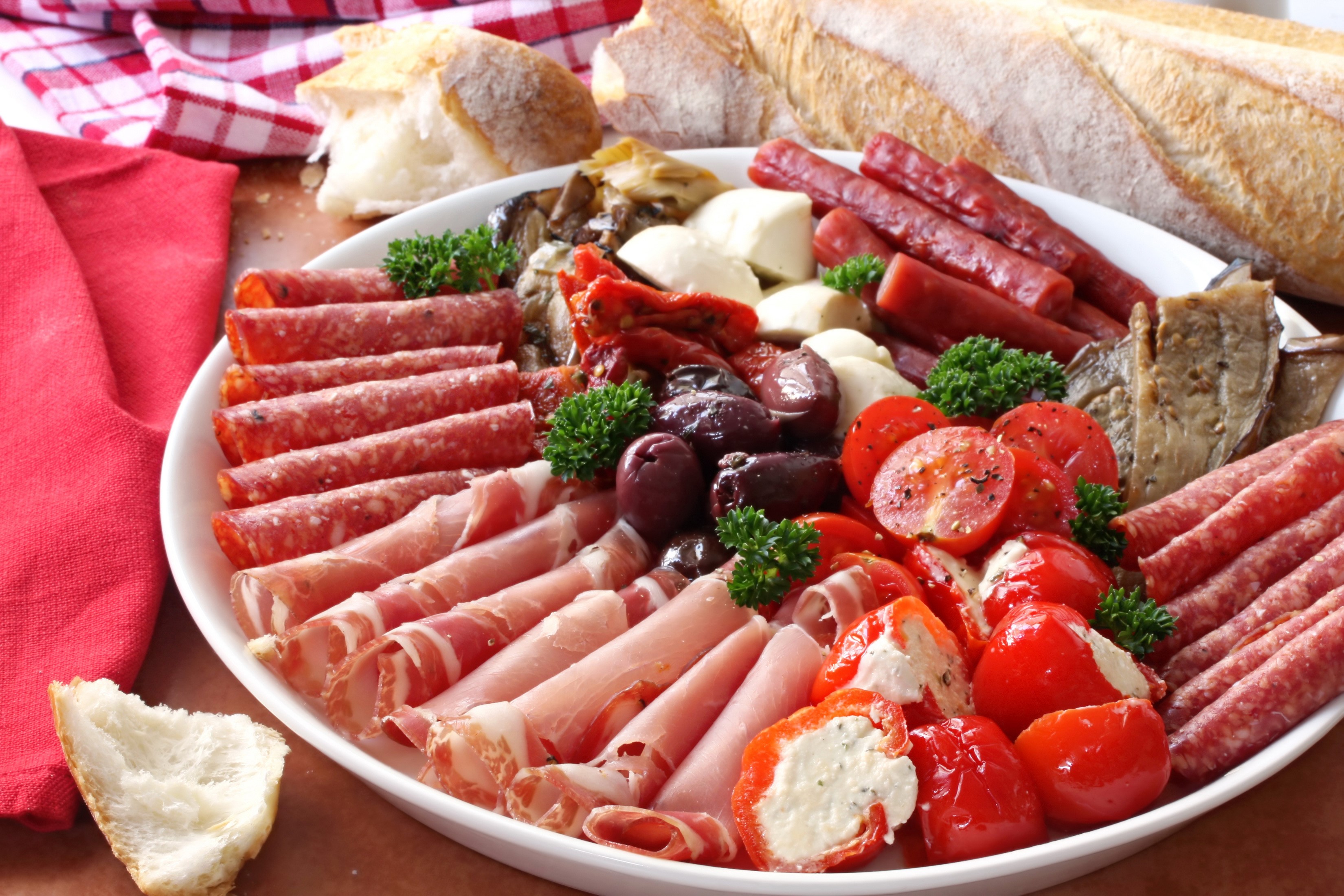 Charcuterie board with meats, cheese, tomatoes, and bread HD Wallpaper