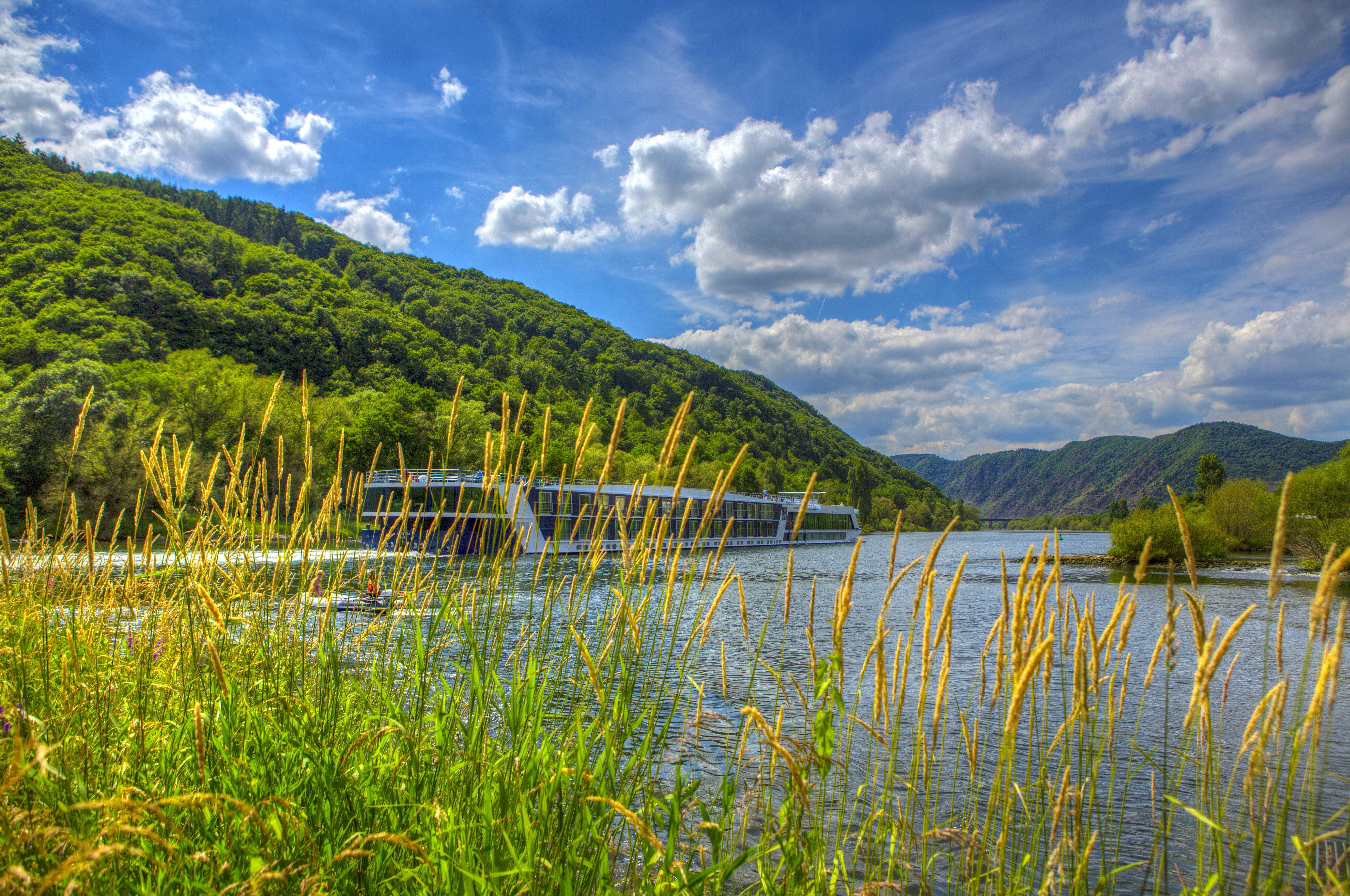 River cruise ship sailing on a river in Germany HD Wallpaper