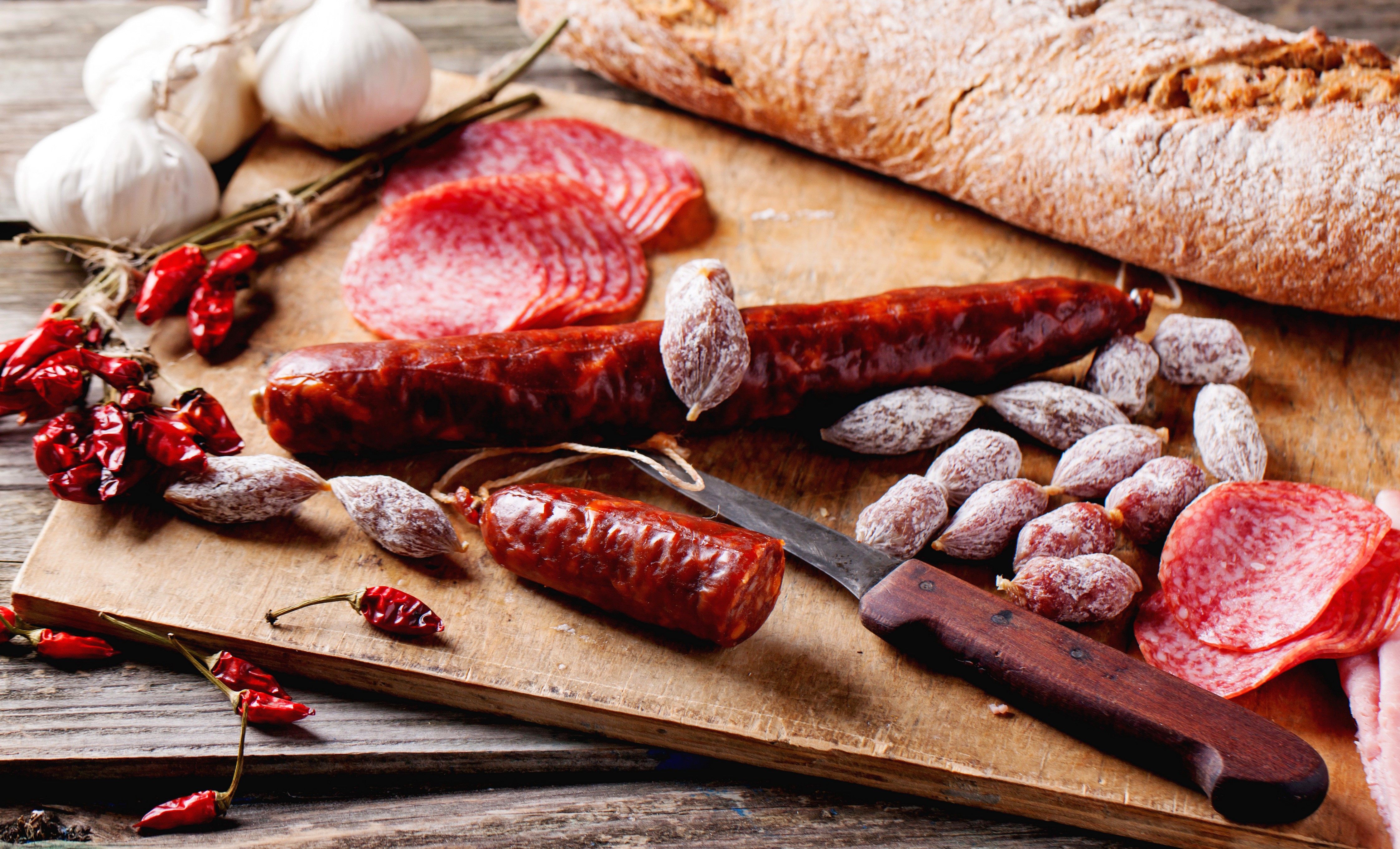 Sausage, Bread, Garlic, and Peppers on a Cutting Board HD Wallpaper