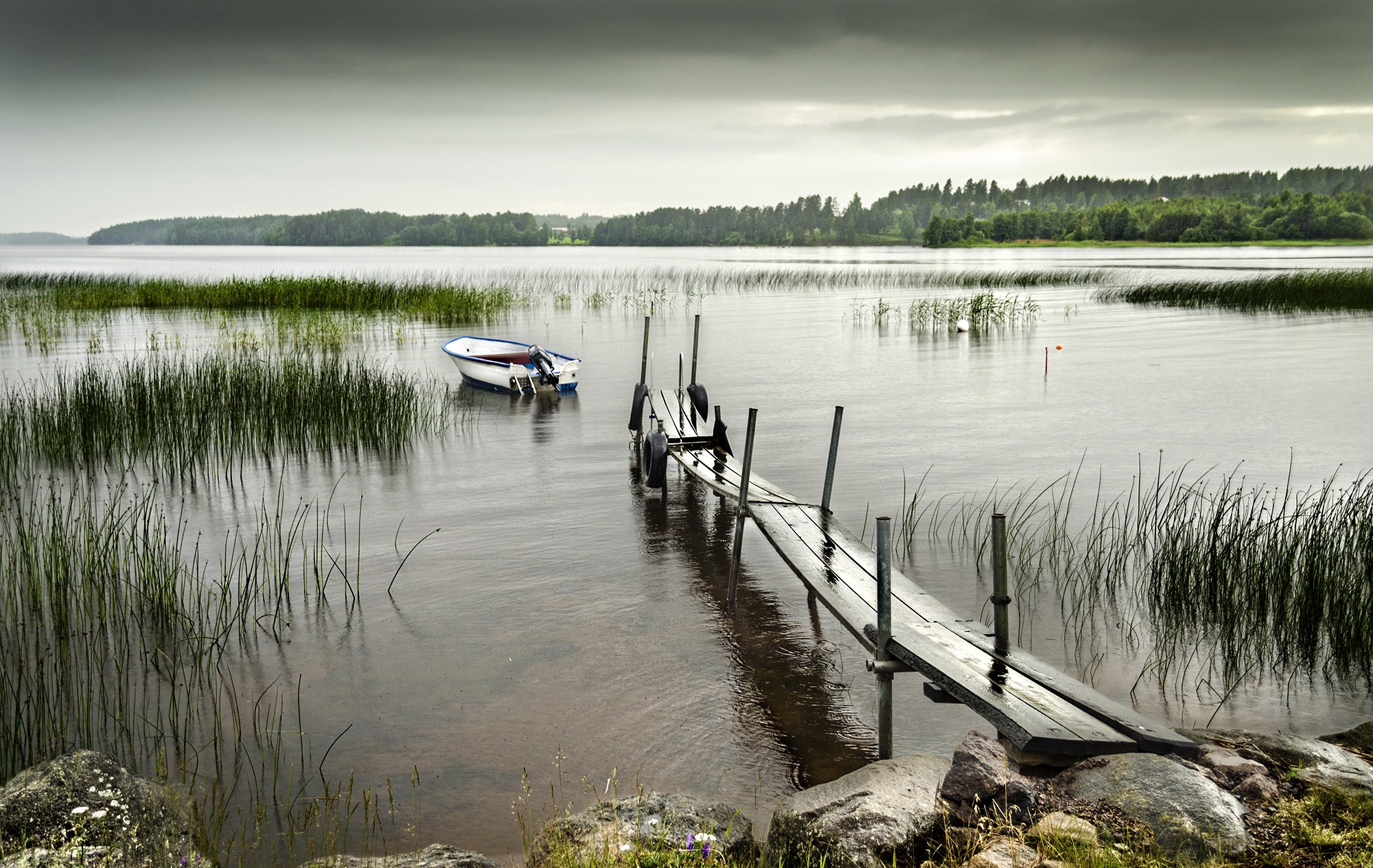 Boat and dock on a lake in Sweden HD Wallpaper