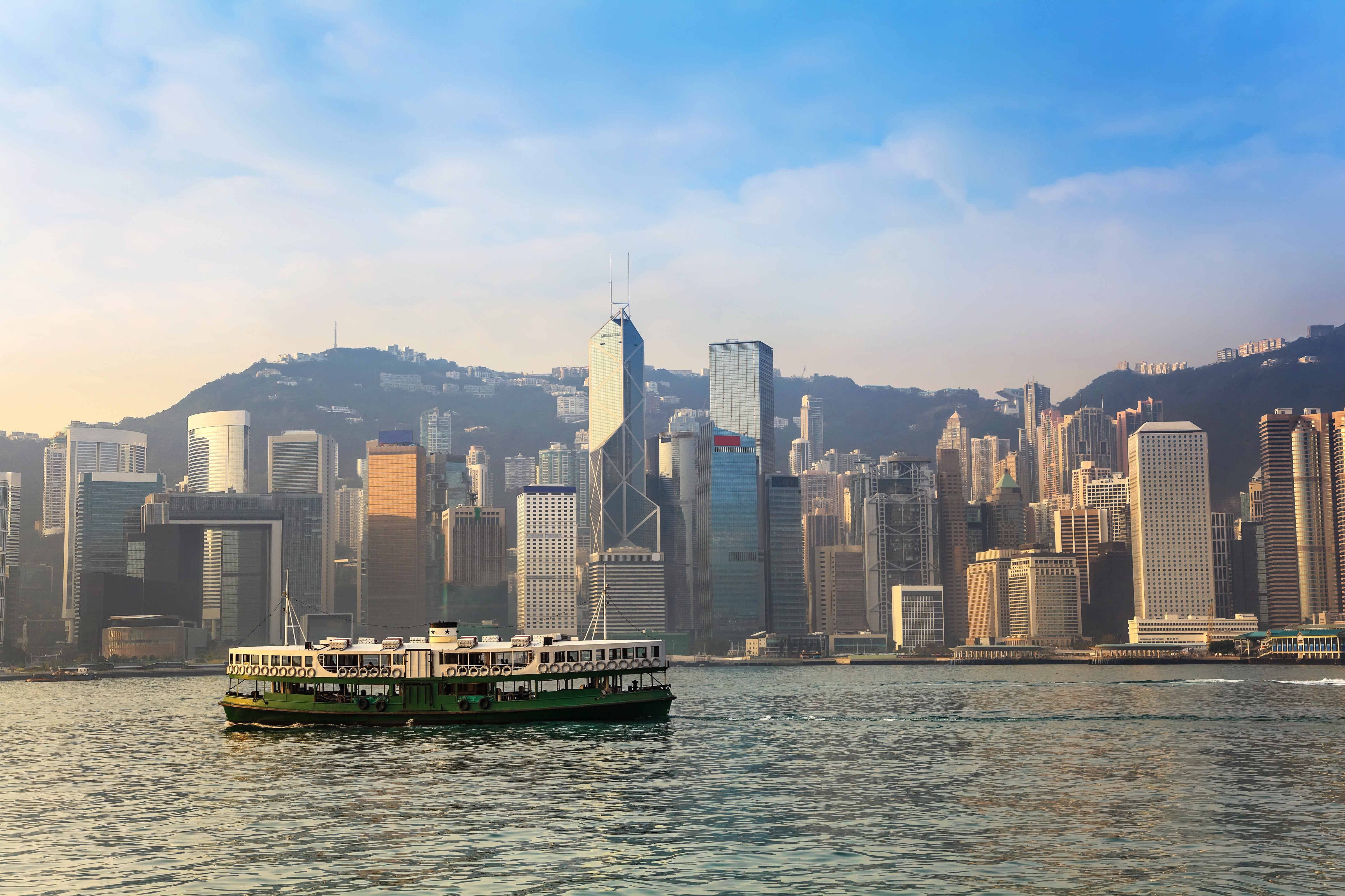 Hong Kong harbor with Star Ferry and skyscrapers HD Wallpaper