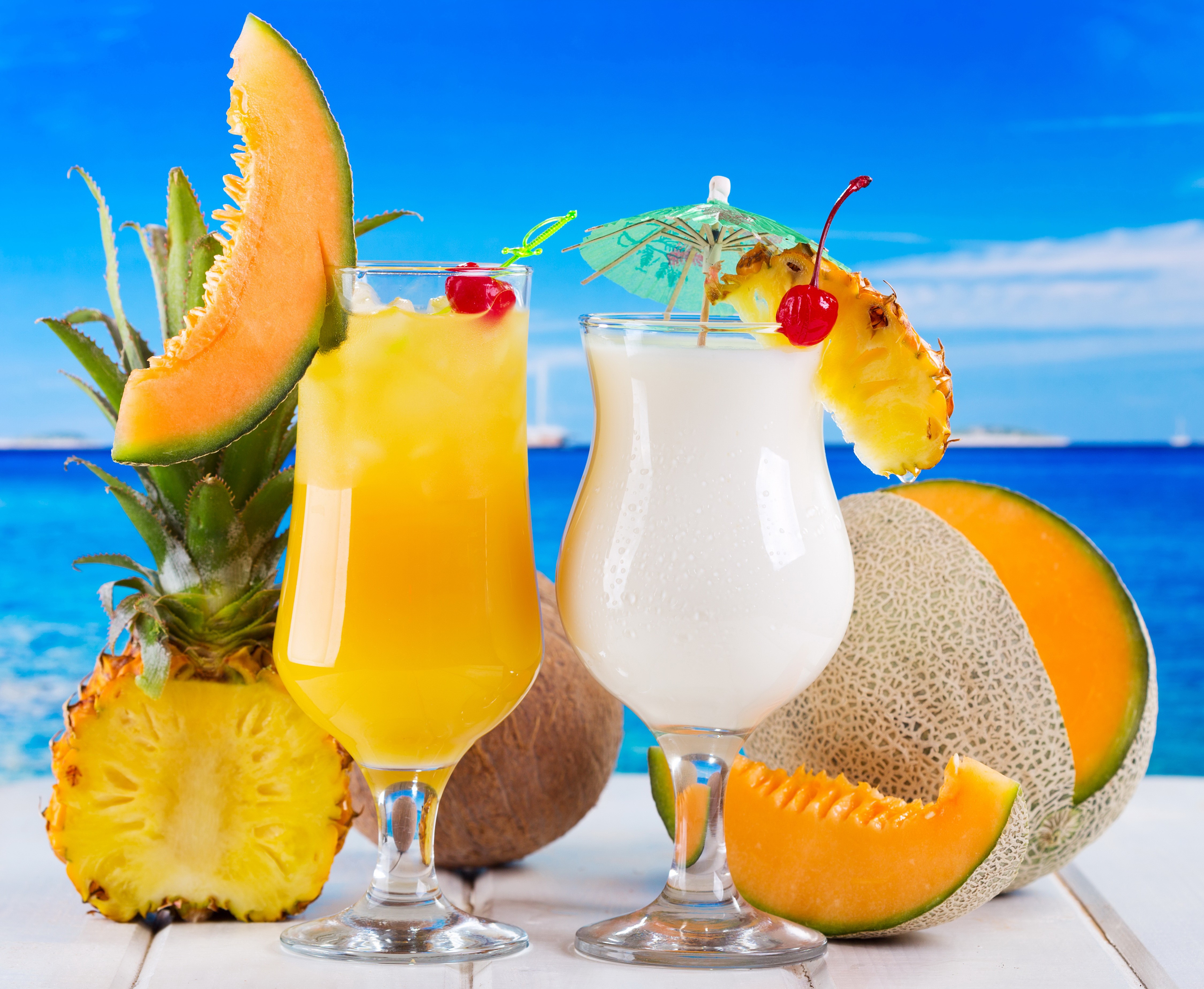Tropical Drinks with Fruits and Ocean Background HD Wallpaper