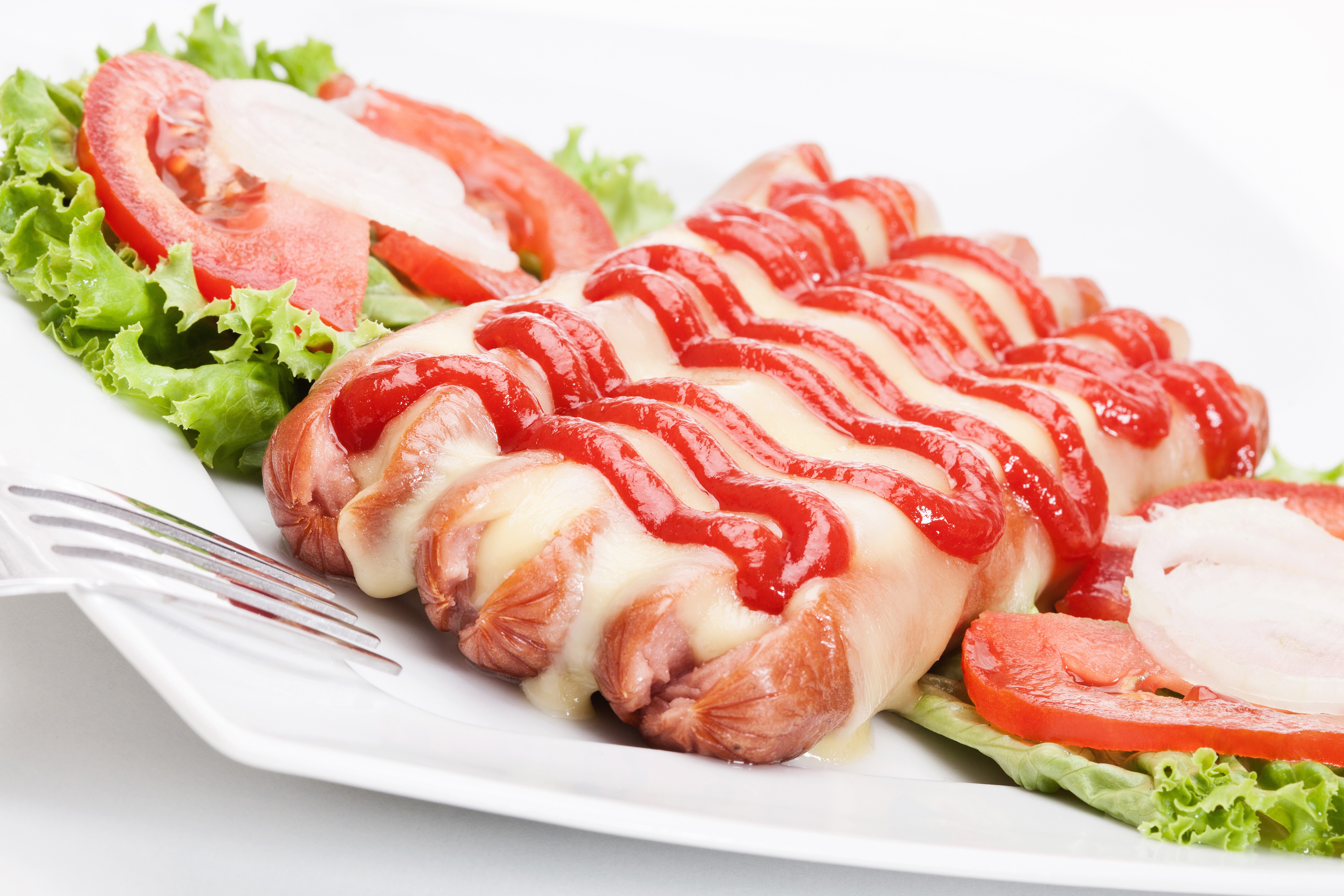 Vienna sausages with cheese and ketchup on a plate HD Wallpaper