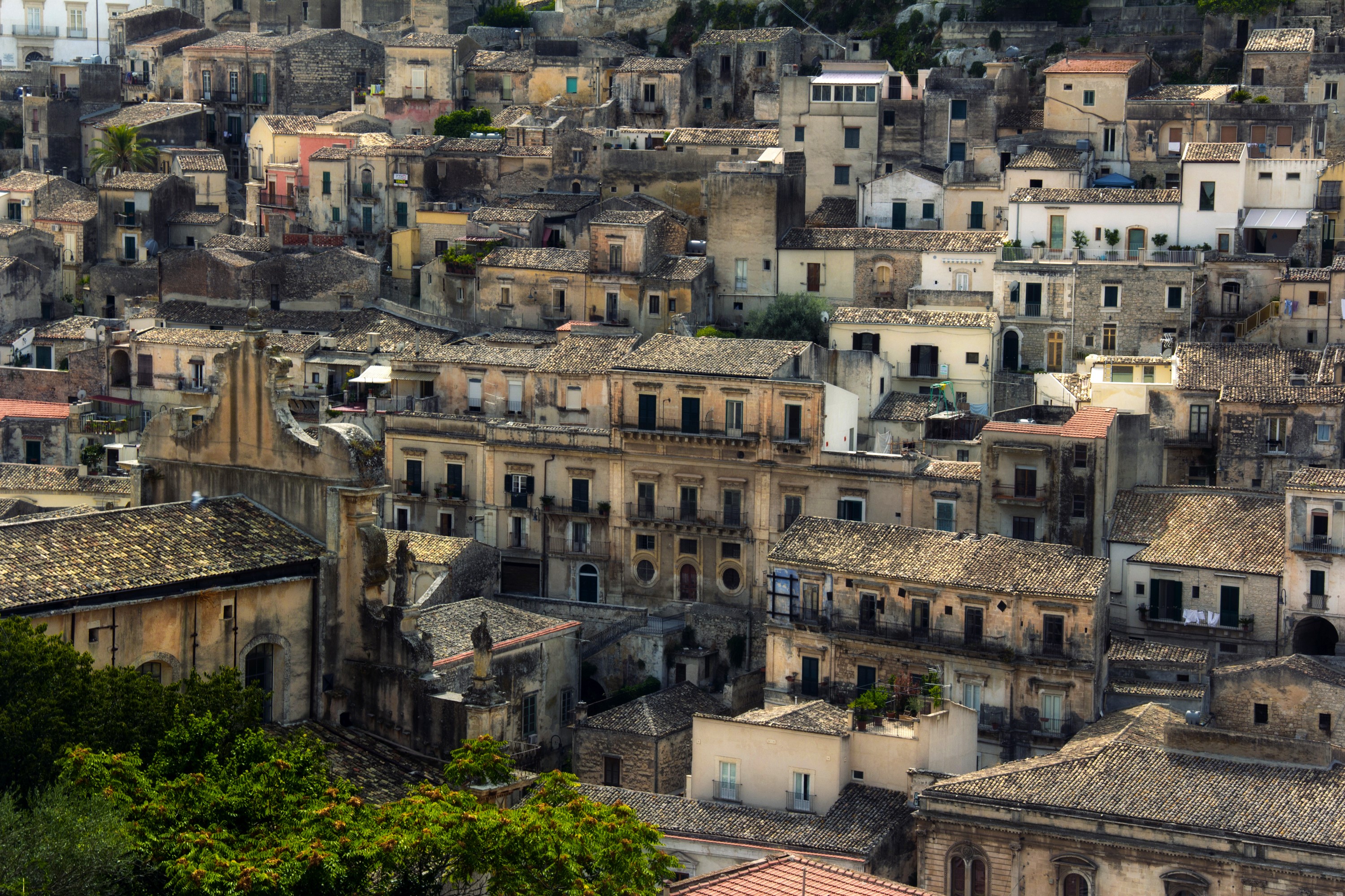 Modica, Italy: A dense hillside town with tiled roofs. HD Wallpaper